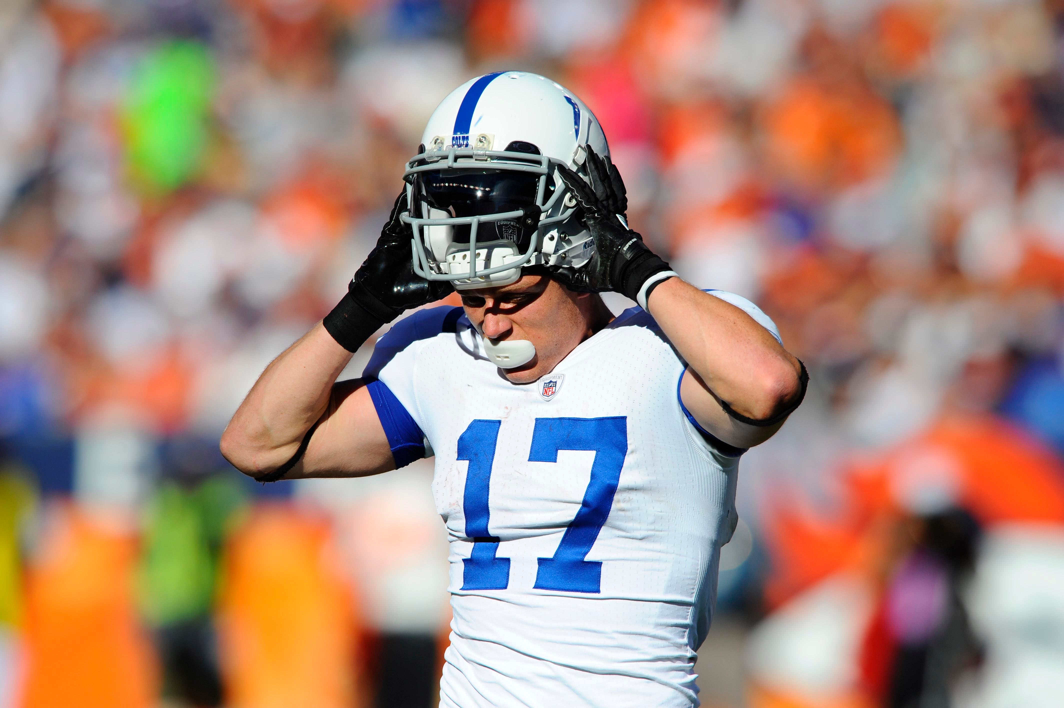 Sept 26, 2010; Denver, CO, USA; Indianapolis Colts wide receiver Austin Collie (17) comes off the field after losing his helmet after a tackle during the game against the Denver Broncos at Invesco Field. The Colts defeated the Broncos 27-13.