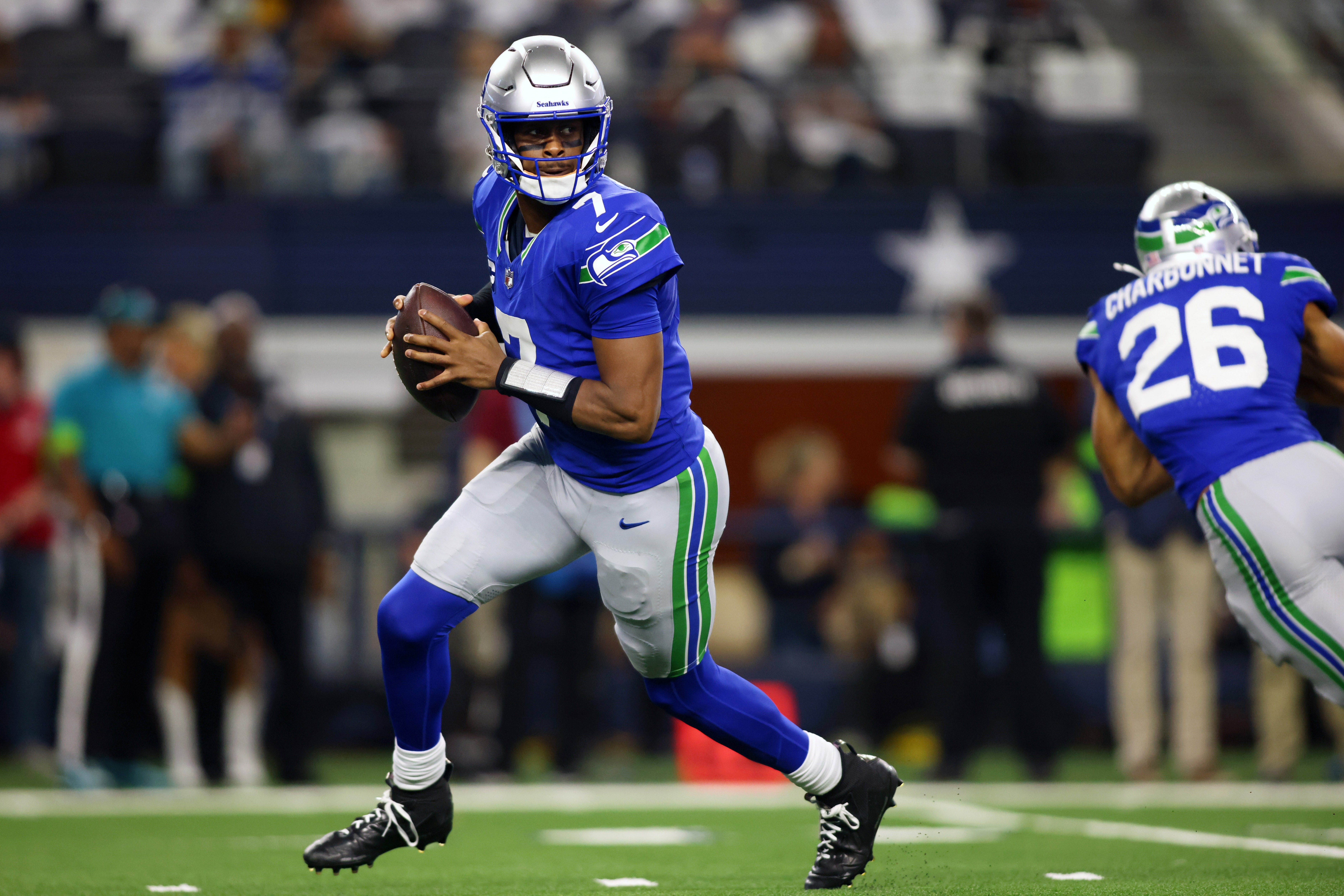 Nov 30, 2023; Arlington, Texas, USA; Seattle Seahawks quarterback Geno Smith (7) looks to pass against the Dallas Cowboys during the first half at AT&T Stadium.