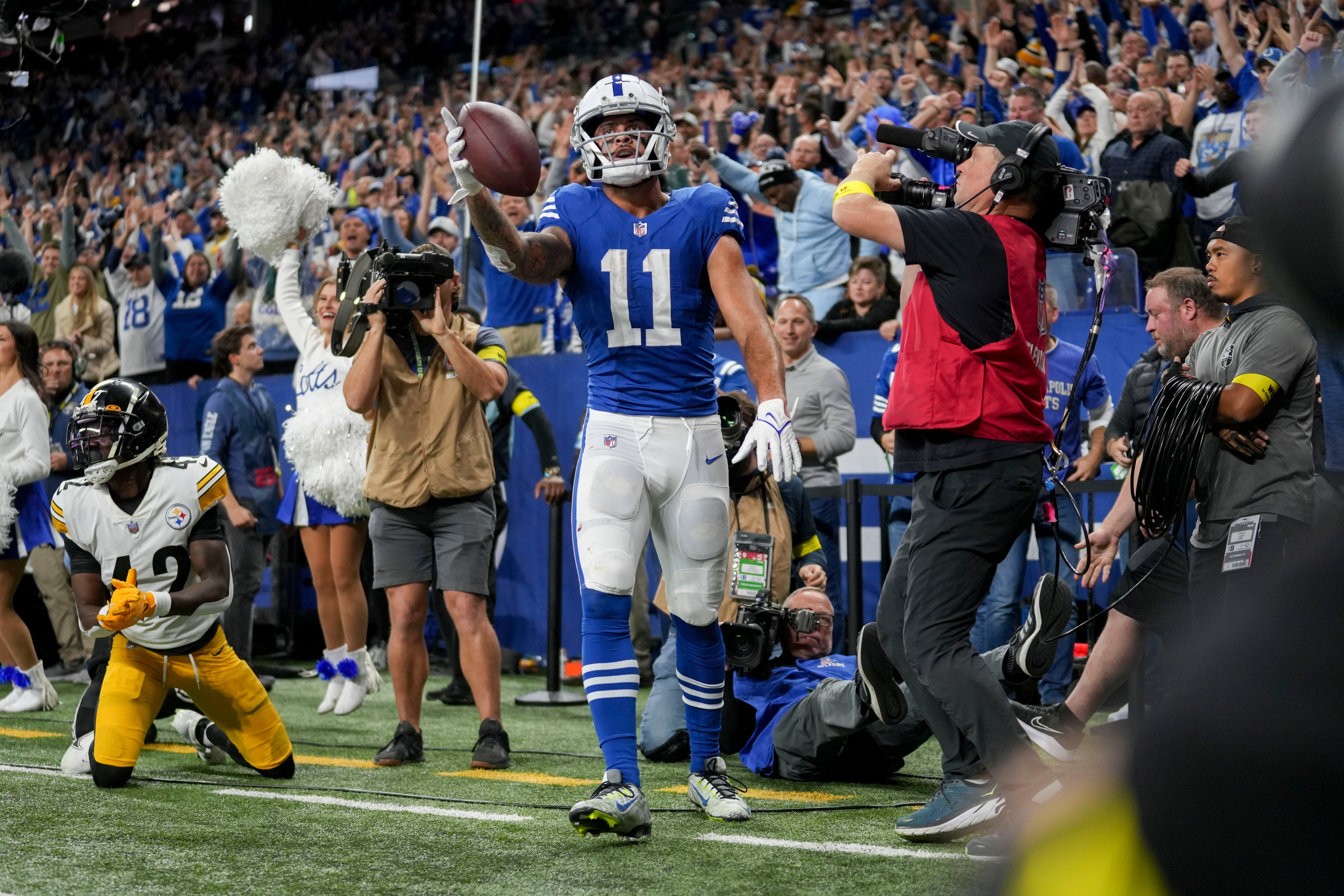 Nov 28, 2022; Indianapolis, Indiana, USA; Indianapolis Colts wide receiver Michael Pittman Jr. (11) celebrates after scoring a touchdown during the second half against the Pittsburgh Steelers at Lucas Oil Stadium.