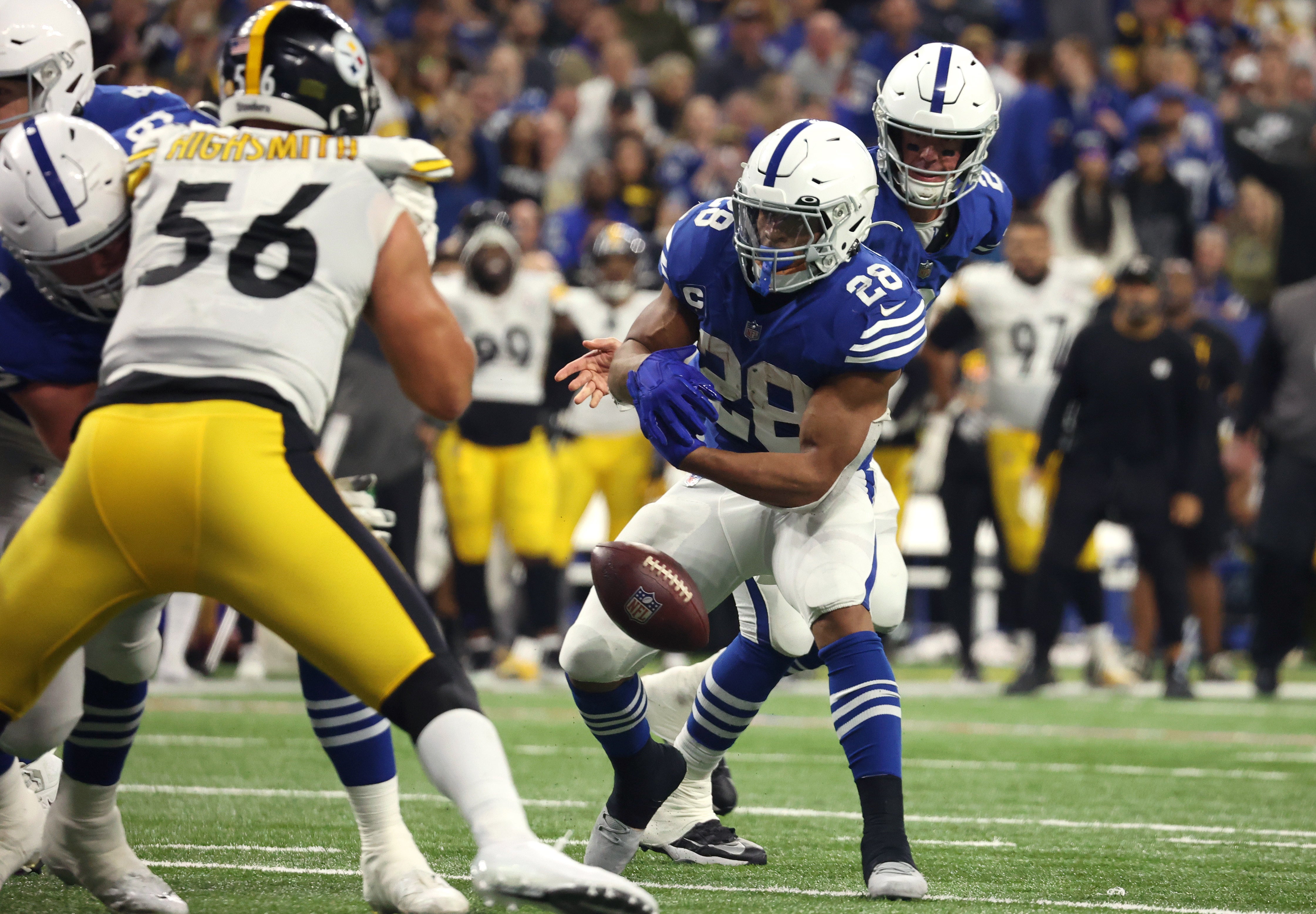Nov 28, 2022; Indianapolis, Indiana, USA; Indianapolis Colts quarterback Matt Ryan (2) fumbles the ball on the handoff to running back Jonathan Taylor (28) during the second half against the Pittsburgh Steelers at Lucas Oil Stadium. Mandatory Credit: Trevor Ruszkowski-USA TODAY Sports