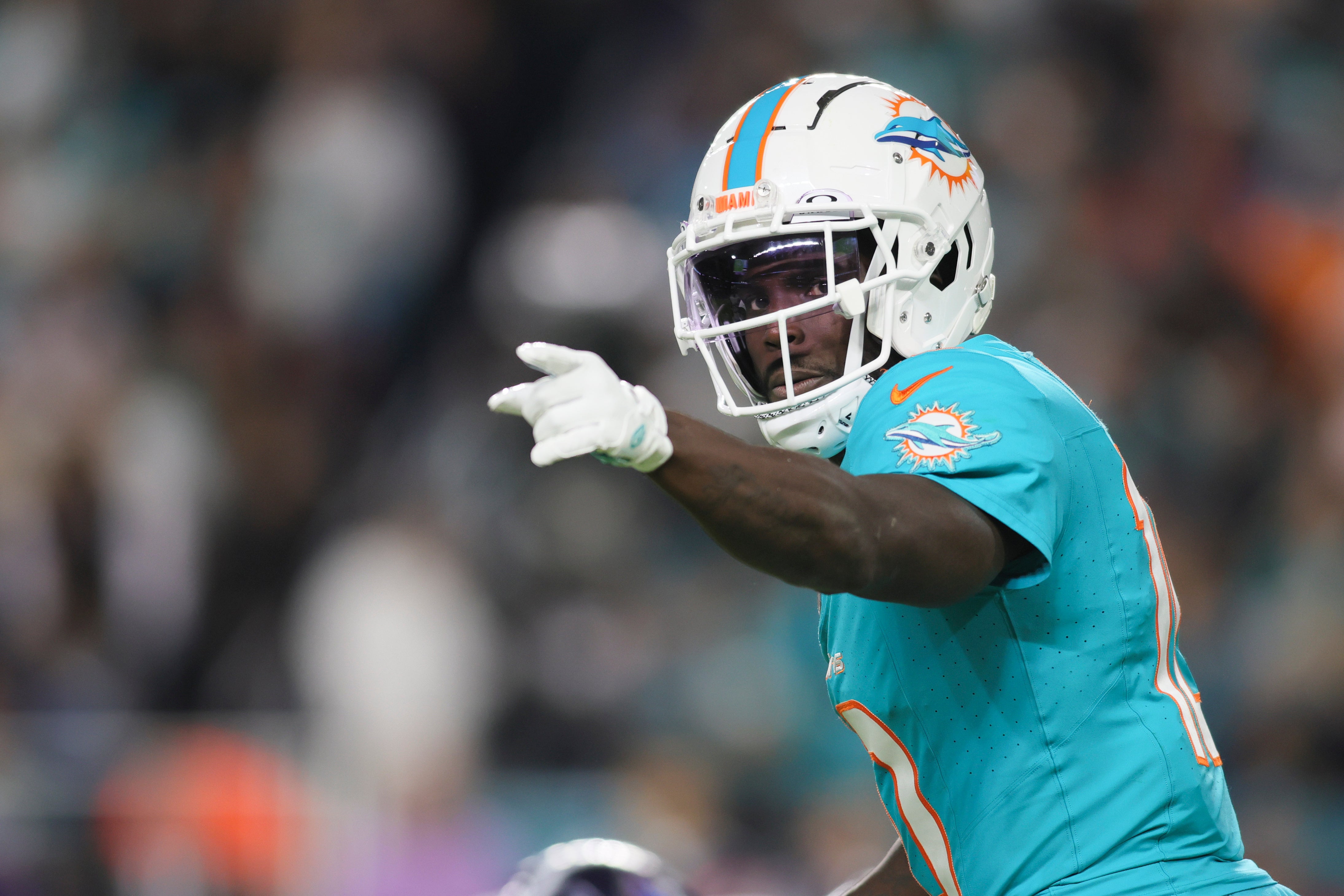 Miami Dolphins wide receiver Tyreek Hill signals from the field against the Tennessee Titans during the third quarter at Hard Rock Stadium.