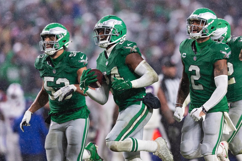 Philadelphia Eagles cornerback James Bradberry (24) celebrates with cornerback Darius Slay (2) and linebacker Christian Elliss (53) after his interception against the Buffalo Bills