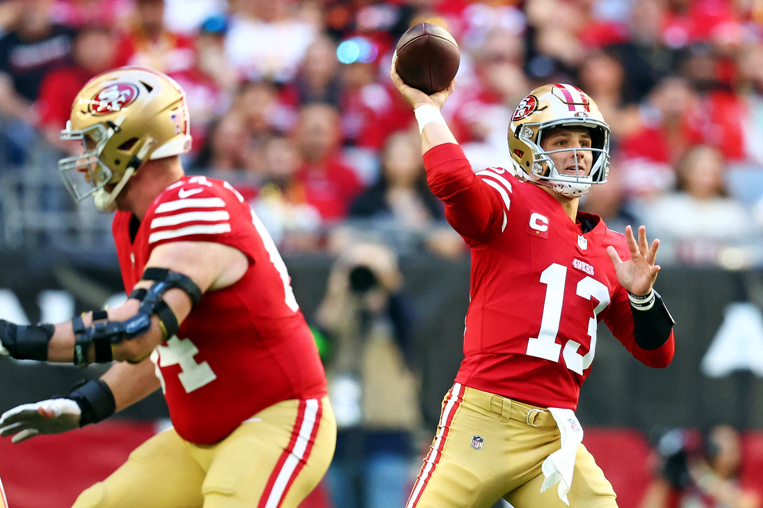 Dec 17, 2023; Glendale, Arizona, USA; San Francisco 49ers quarterback Brock Purdy (13) throws a pass during the first quarter against the Arizona Cardinals at State Farm Stadium.