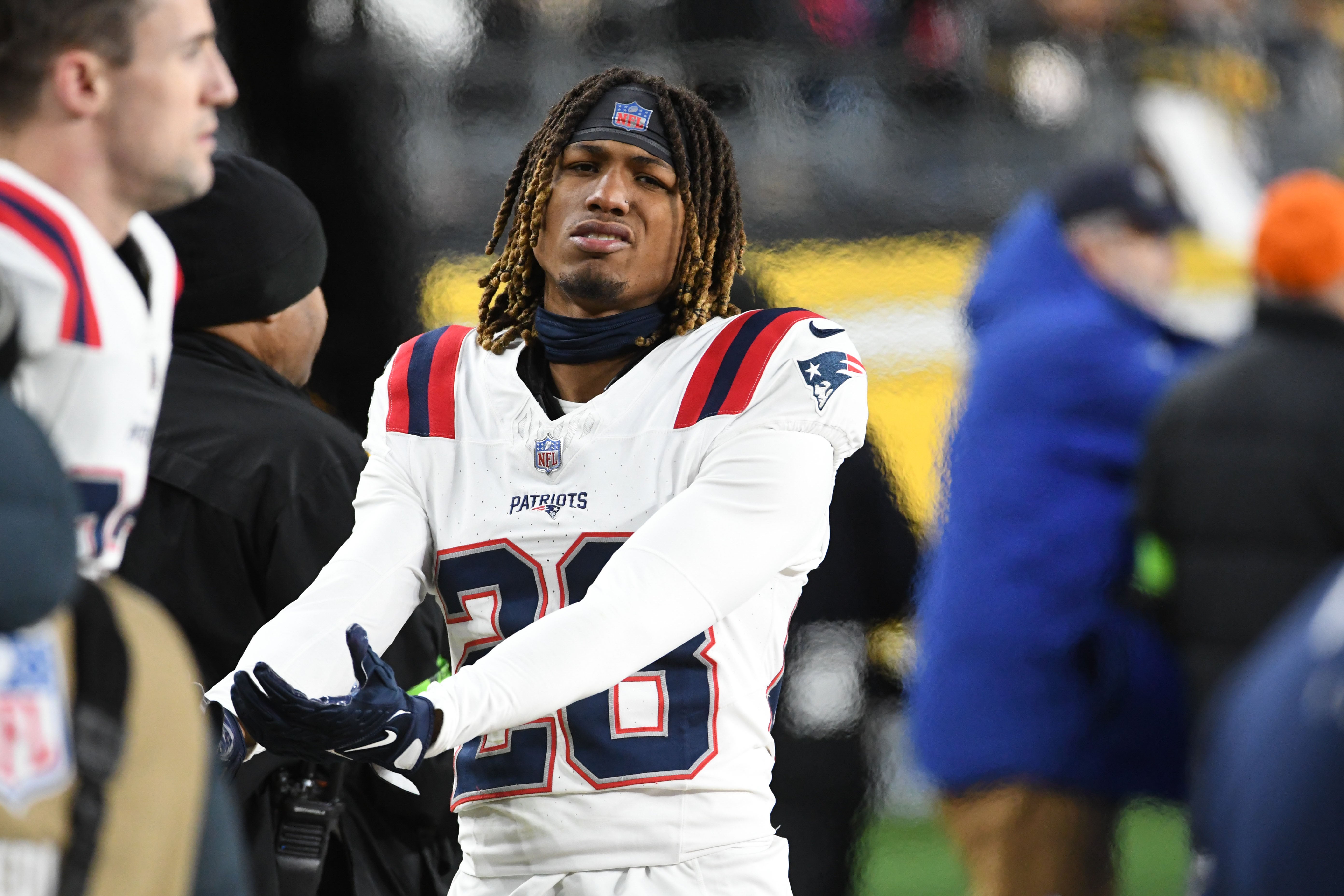 New England Patriots defensive back Alex Austin on the sidelines in a game against the Pittsburgh Steelers at Acrisure Stadium.