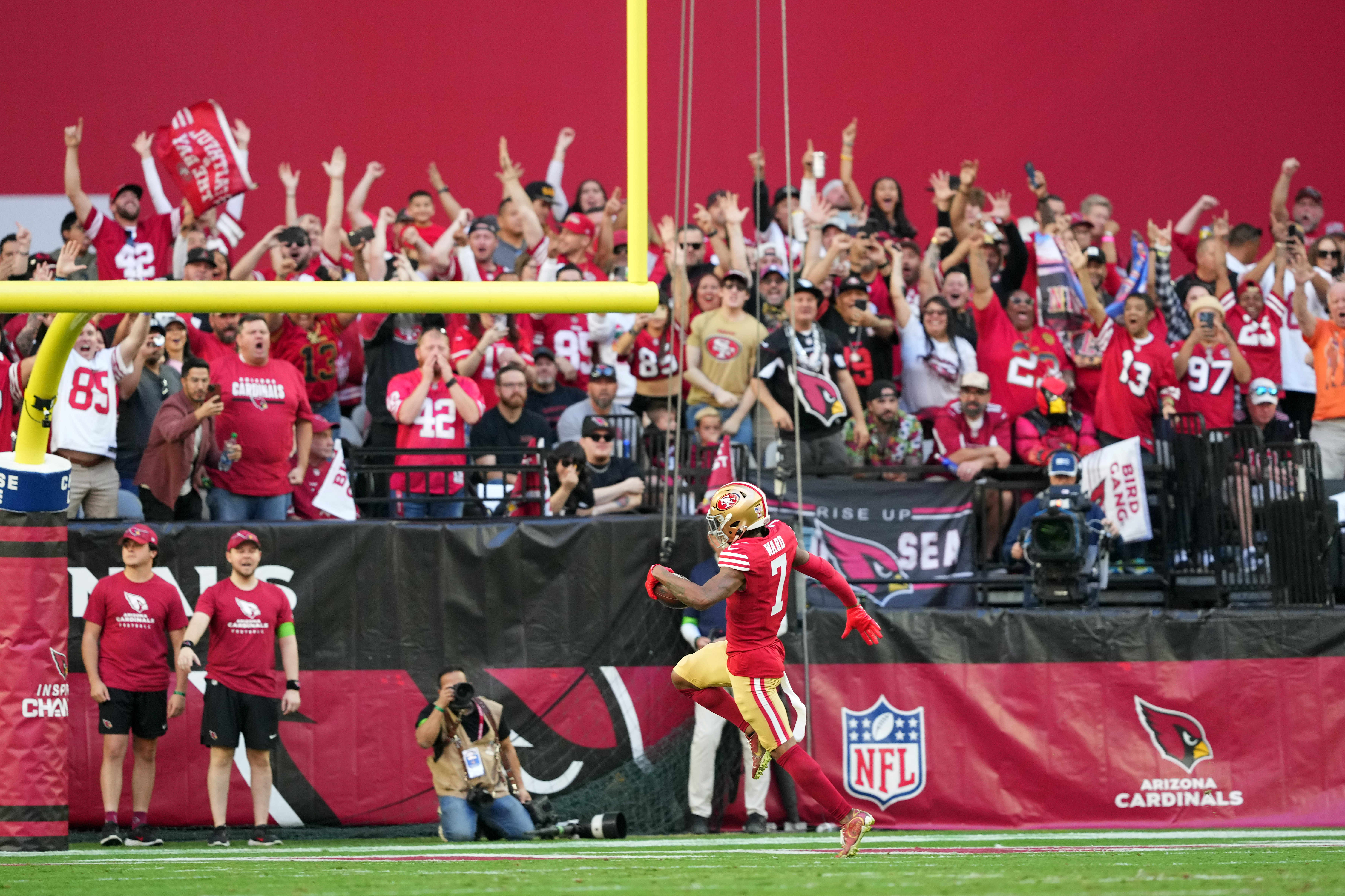 Dec 17, 2023; Glendale, Arizona, USA; San Francisco 49ers cornerback Charvarius Ward (7) scores a touchdown after intercepting a pass against the Arizona Cardinals during the first half at State Farm Stadium.
