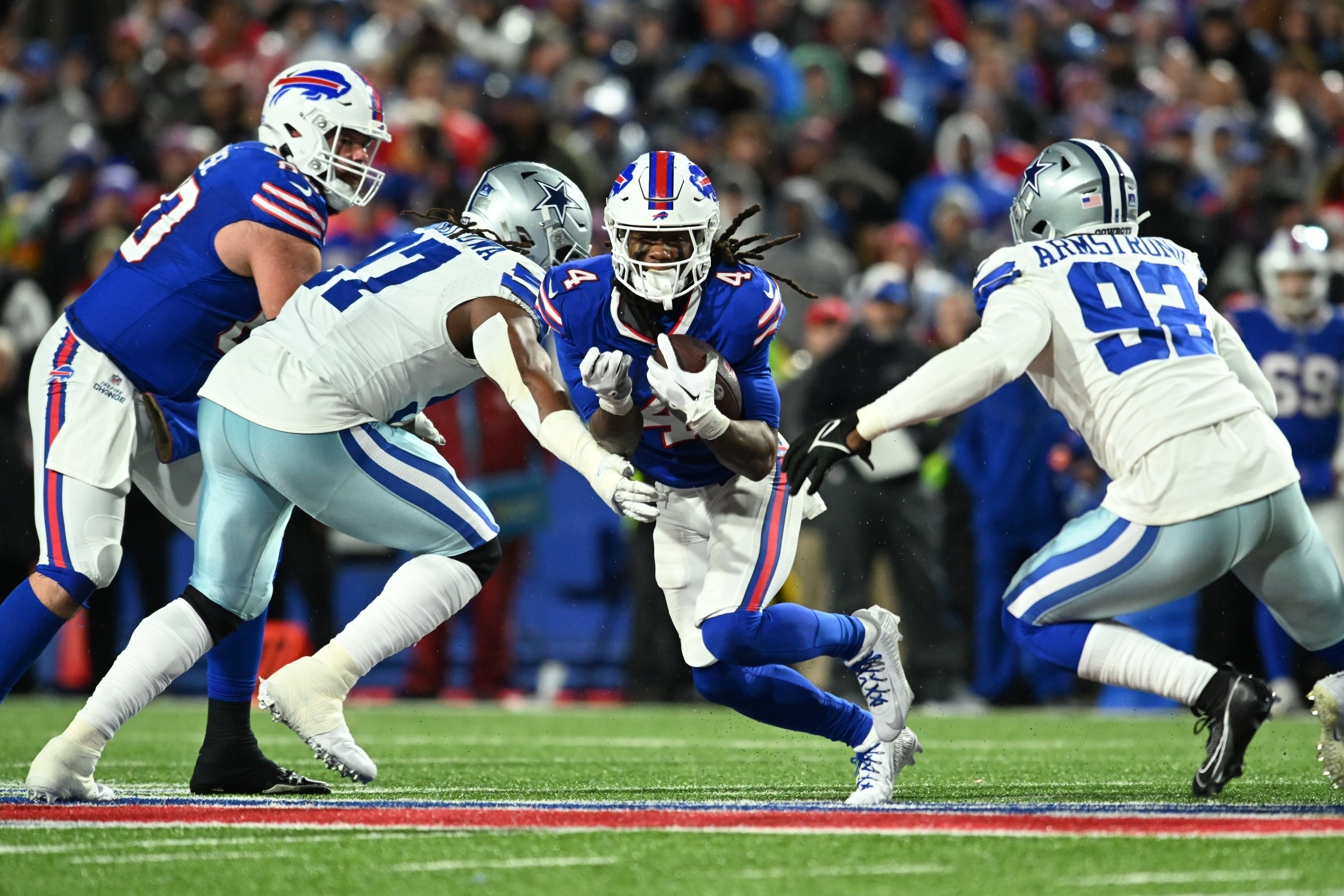 James Cook runs his way to 179 rushing yards against the Cowboys.