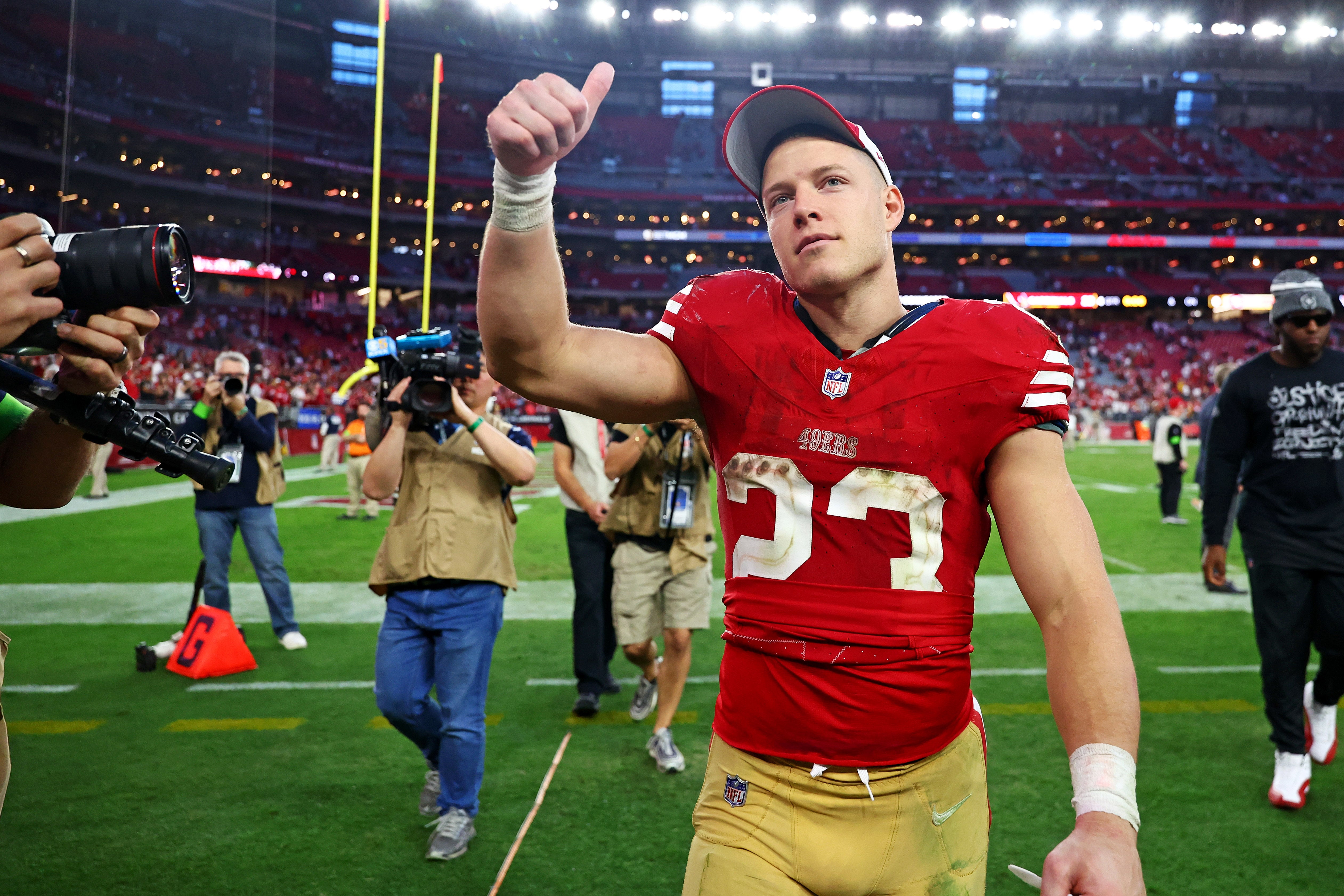 Dec 17, 2023; Glendale, Arizona, USA; San Francisco 49ers running back Christian McCaffrey (23) celebrates after beating the Arizona Cardinals at State Farm Stadium.