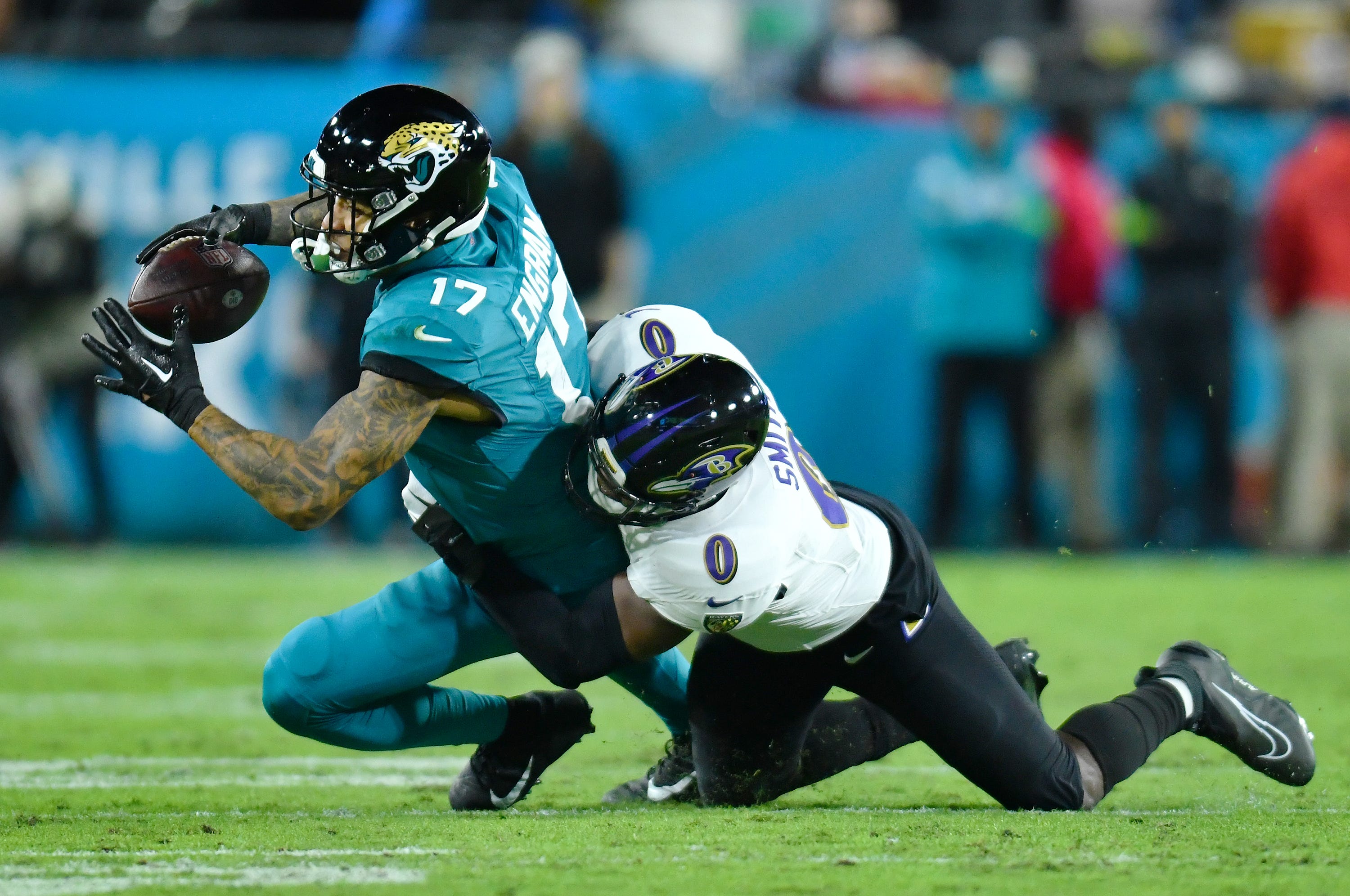 Baltimore Ravens linebacker Roquan Smith (0) brings down Jacksonville Jaguars tight end Evan Engram (17) on an early second quarter pass play. The Jacksonville Jaguars hosted the Baltimore Ravens at EverBank Stadium in Jacksonville, Florida Sunday Night, December 17, 2023. The Jaguars trailed 10 to 0 at the half.