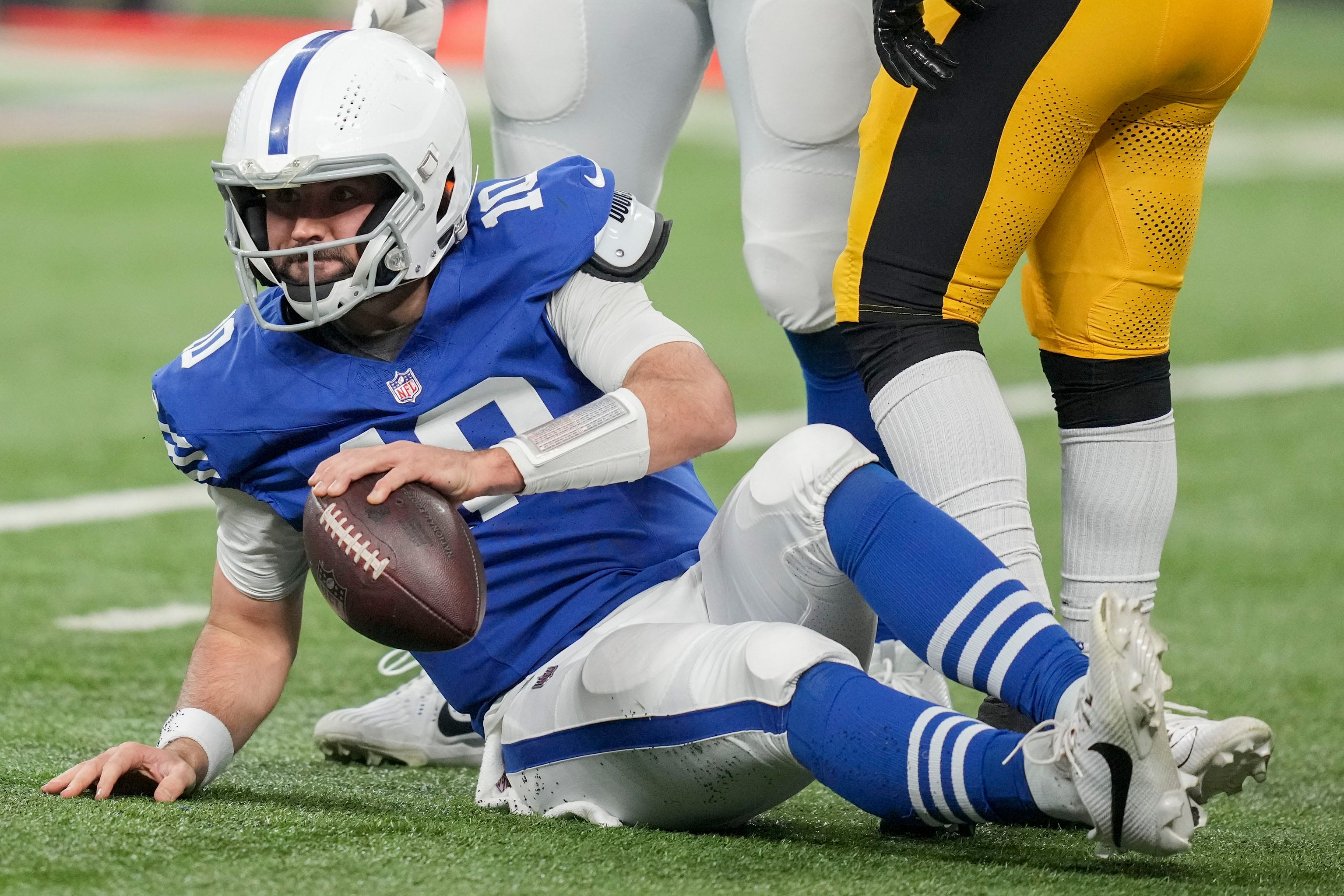 Indianapolis Colts quarterback Gardner Minshew II (10) sits on the turf after a sack Saturday, Dec. 16, 2023, during a game against the Pittsburgh Steelers at Lucas Oil Stadium in Indianapolis.