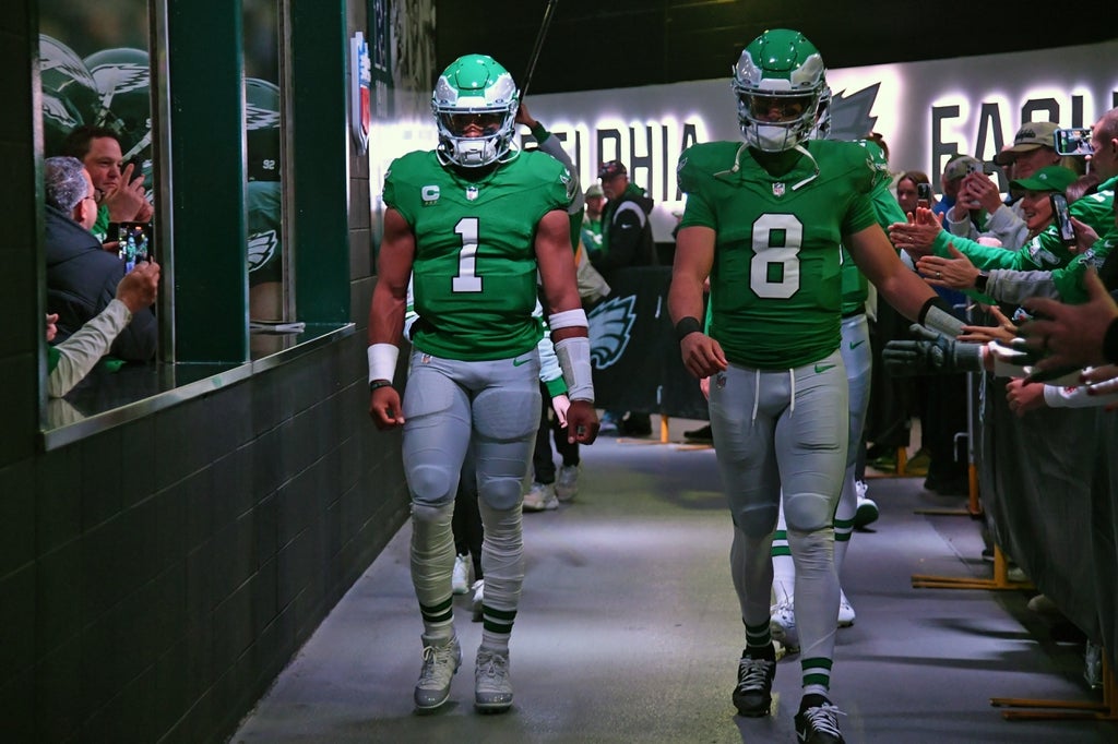 Philadelphia Eagles quarterback Jalen Hurts (1) and quarterback Marcus Mariota (8) in the tunnel before game against the Miami Dolphins at Lincoln Financial Field.