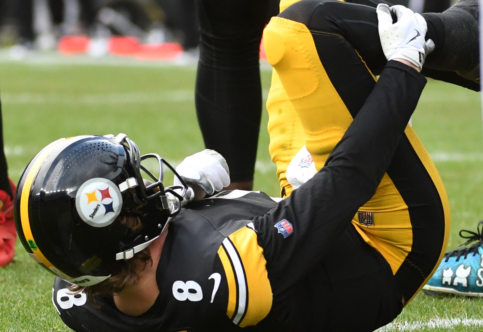 Dec 3, 2023; Pittsburgh, Pennsylvania, USA; Pittsburgh Steelers quarterback Kenny Pickett (8) grabs his leg after play against the Arizona Cardinals during the second quarter at Acrisure Stadium. Pickett left the game with an injury. Mandatory Credit: Philip G. Pavely-USA TODAY Sports
