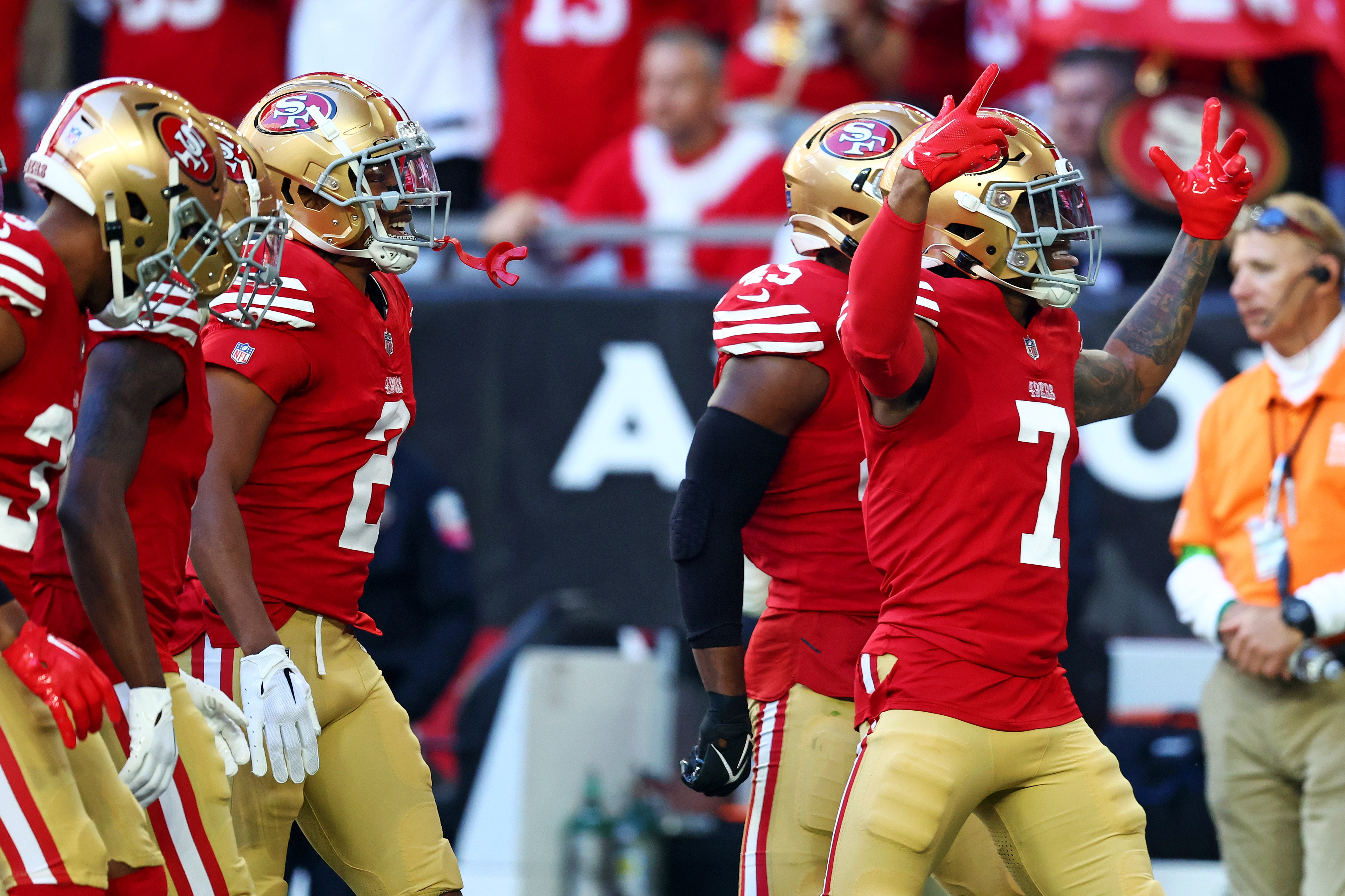 Dec 17, 2023; Glendale, Arizona, USA; San Francisco 49ers cornerback Charvarius Ward (7) celebrates after running back an interception for a touchdown during the first quarter against the Arizona Cardinals at State Farm Stadium.