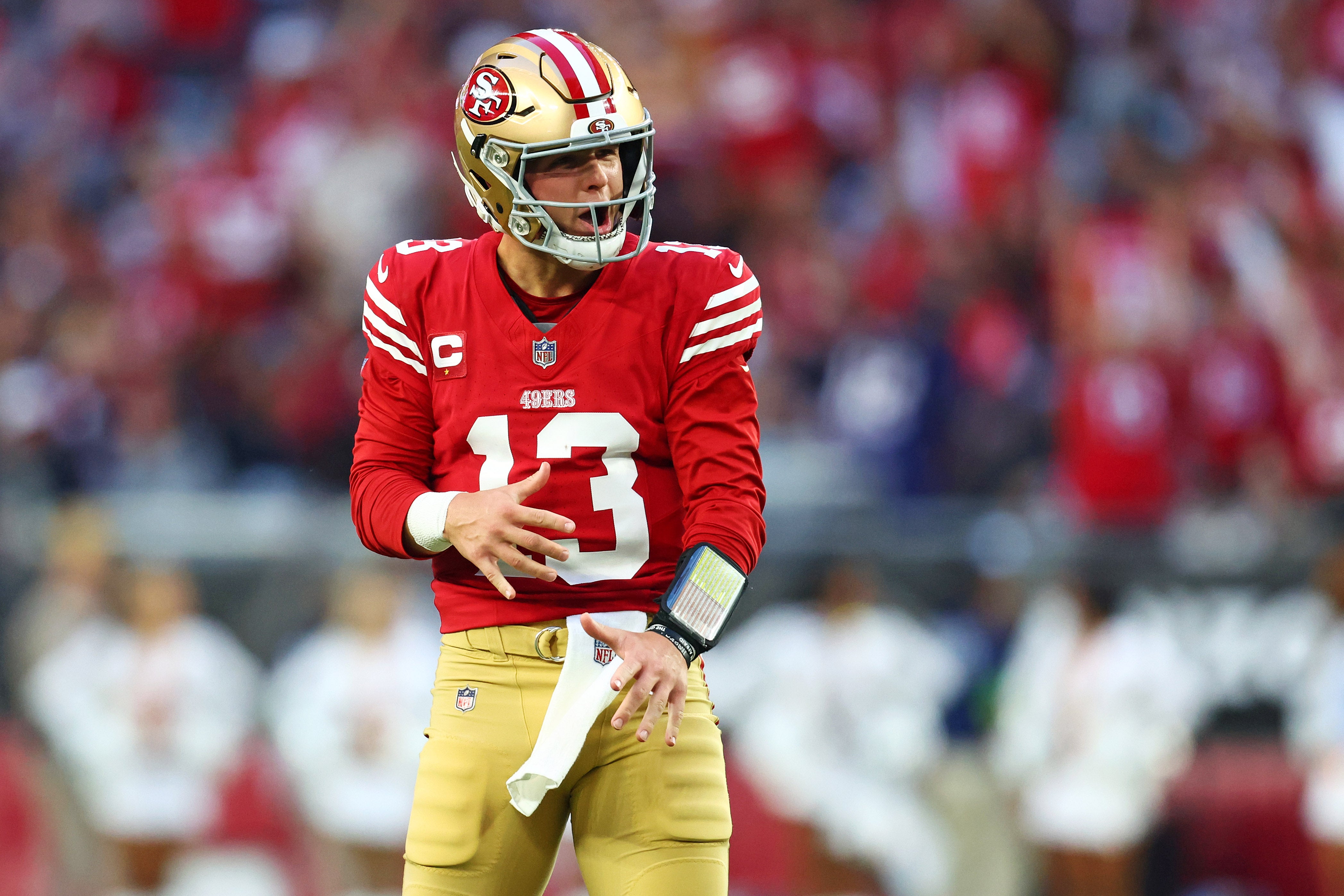 Dec 17, 2023; Glendale, Arizona, USA; San Francisco 49ers quarterback Brock Purdy (13) celebrates after a play during the fourth quarter against the Arizona Cardinals at State Farm Stadium.