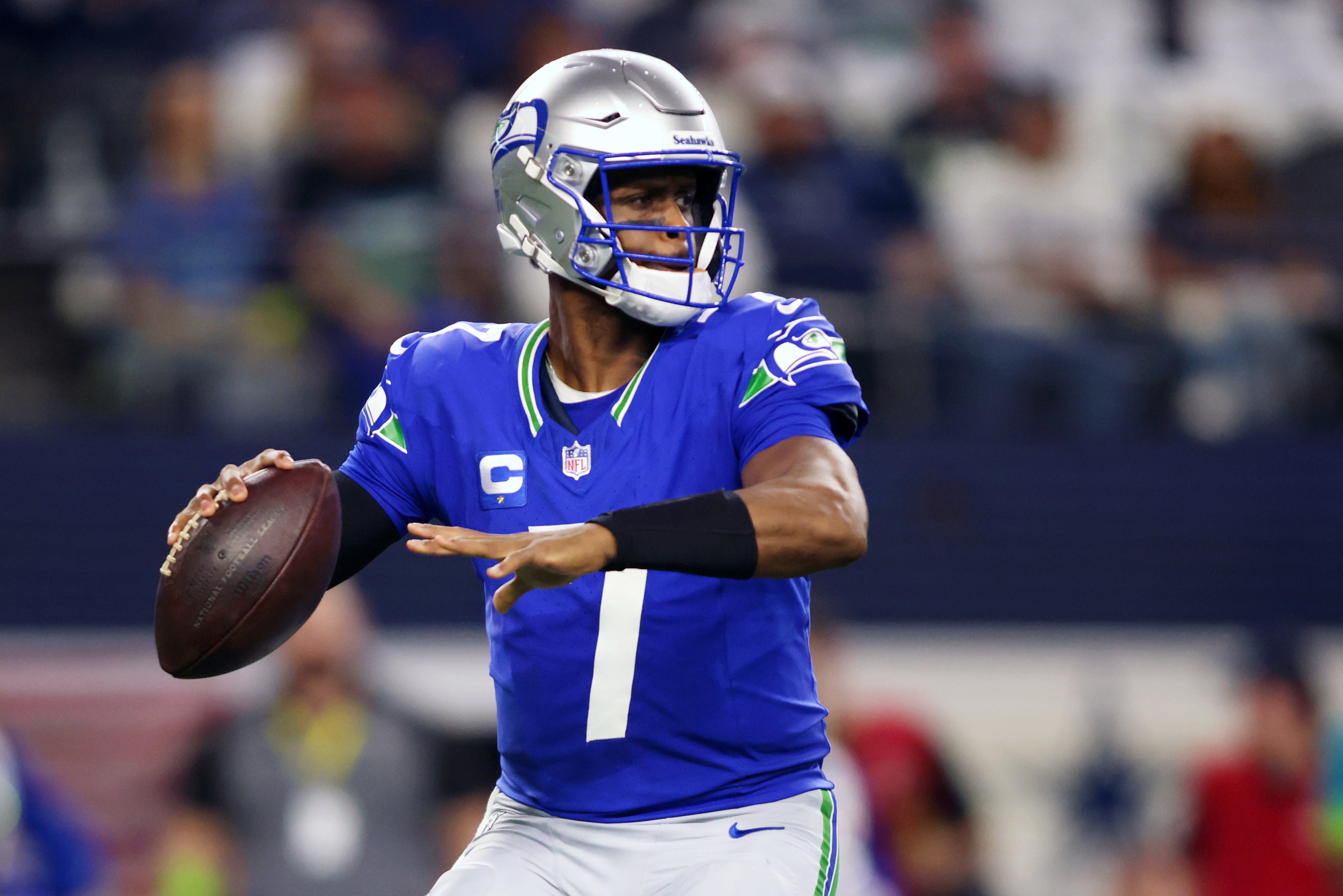 Nov 30, 2023; Arlington, Texas, USA; Seattle Seahawks quarterback Geno Smith (7) looks to pass against the Dallas Cowboys during the first half at AT&T Stadium.
