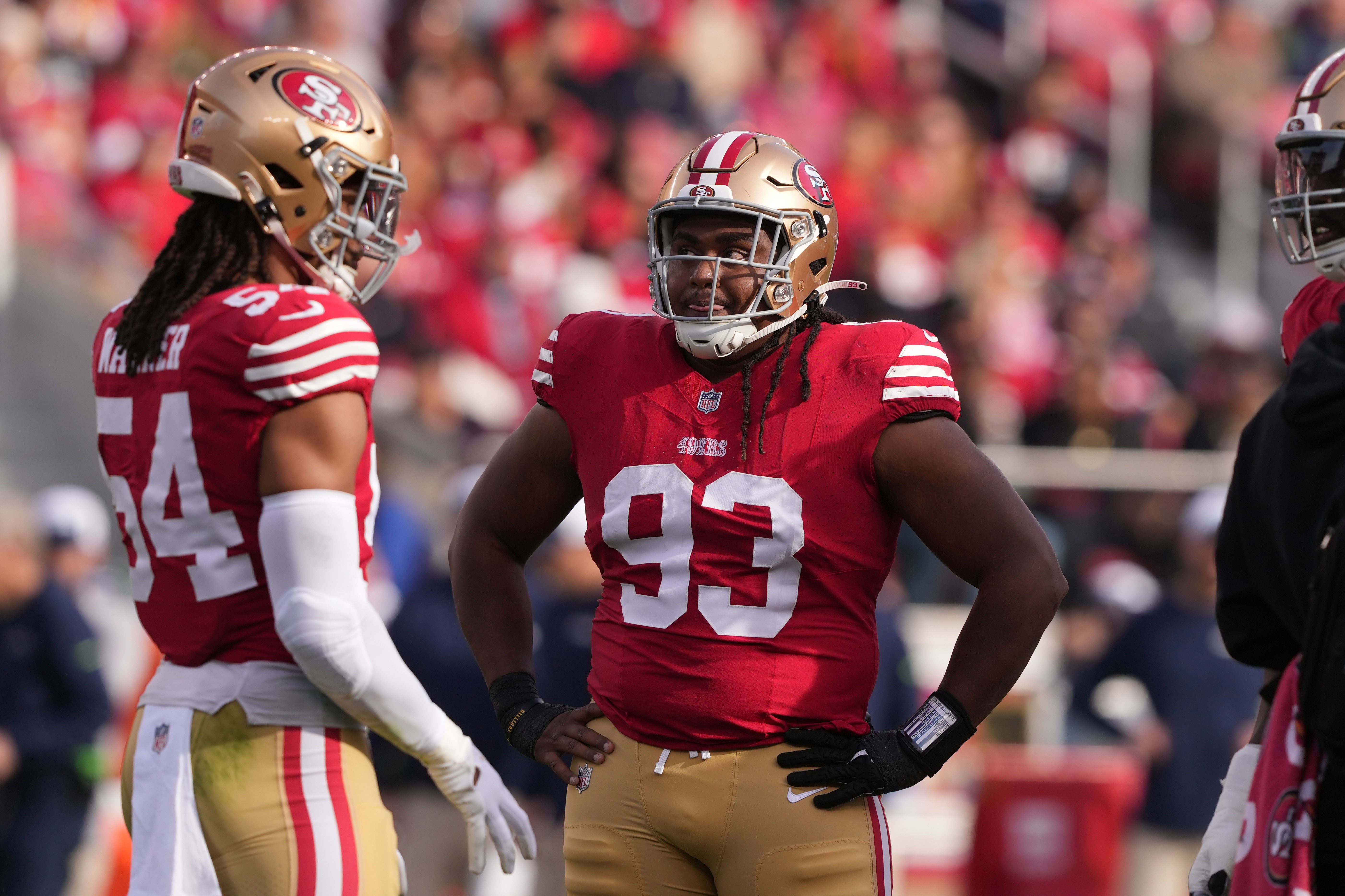 Dec 10, 2023; Santa Clara, California, USA; San Francisco 49ers defensive tackle Kalia Davis (93) stands on the field with linebacker Fred Warner (54) during the first quarter against the Seattle Seahawks at Levi's Stadium.