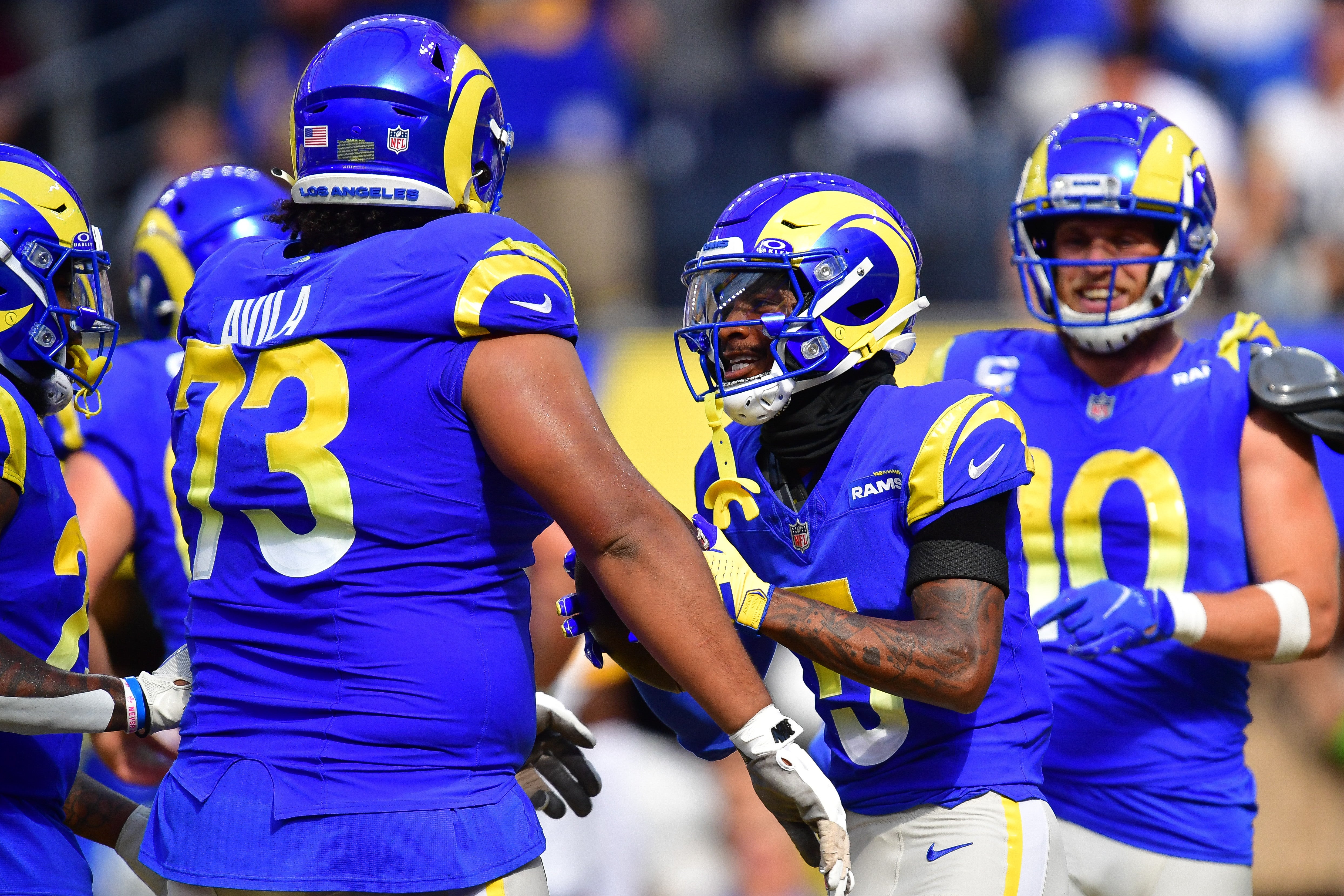 Oct 22, 2023; Inglewood, California, USA; Los Angeles Rams wide receiver Tutu Atwell (5) celebrates his touchdown scored against the Pittsburgh Steelers with guard Steve Avila (73) and wide receiver Cooper Kupp (10) during the first half at SoFi Stadium. Mandatory Credit: Gary A. Vasquez-USA TODAY Sports