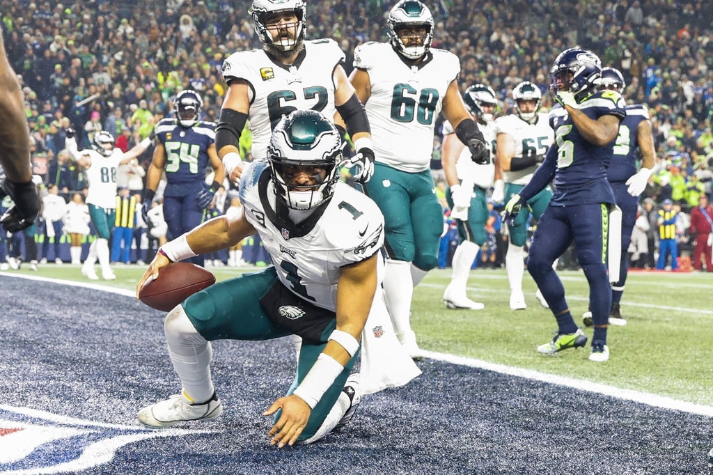 Philadelphia Eagles quarterback Jalen Hurts (1) reacts after rushing for a touchdown against the Seattle Seahawks during the first quarter at Lumen Field.