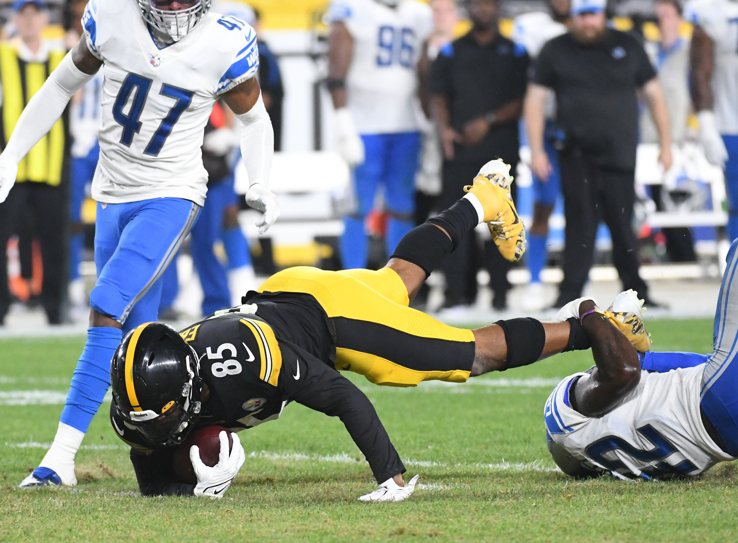 Aug 21, 2021; Pittsburgh, Pennsylvania, USA; Pittsburgh Steelers tight end Eric Ebron (85) is tackled during the third quarter by Detroit Lions safety Jalen Elliott (42) at Heinz Field. Mandatory Credit: Philip G. Pavely-USA TODAY Sports