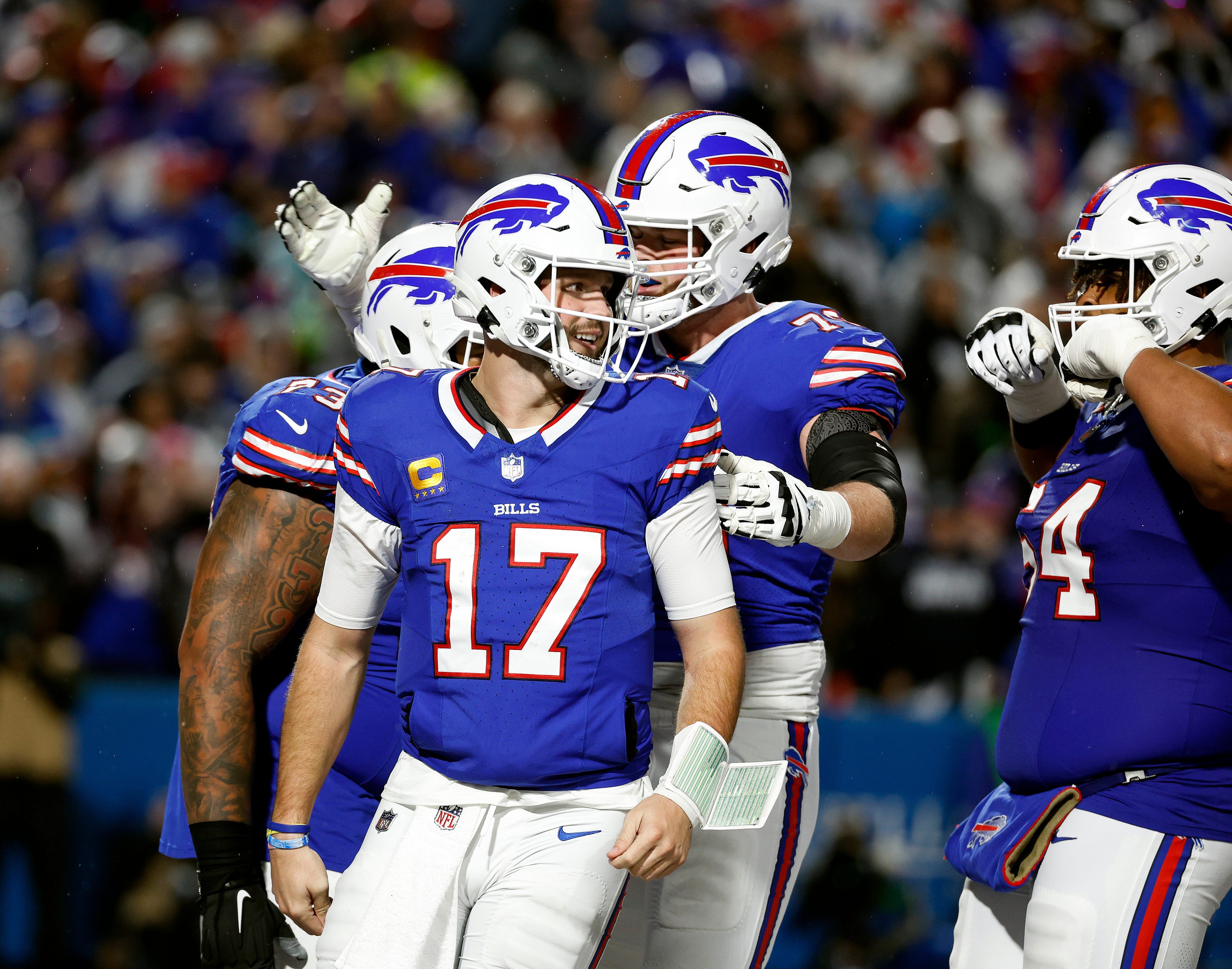 Buffalo Bills quarterback Josh Allen (17) celebrates his 1-yard touchdown run against the Cowboys.