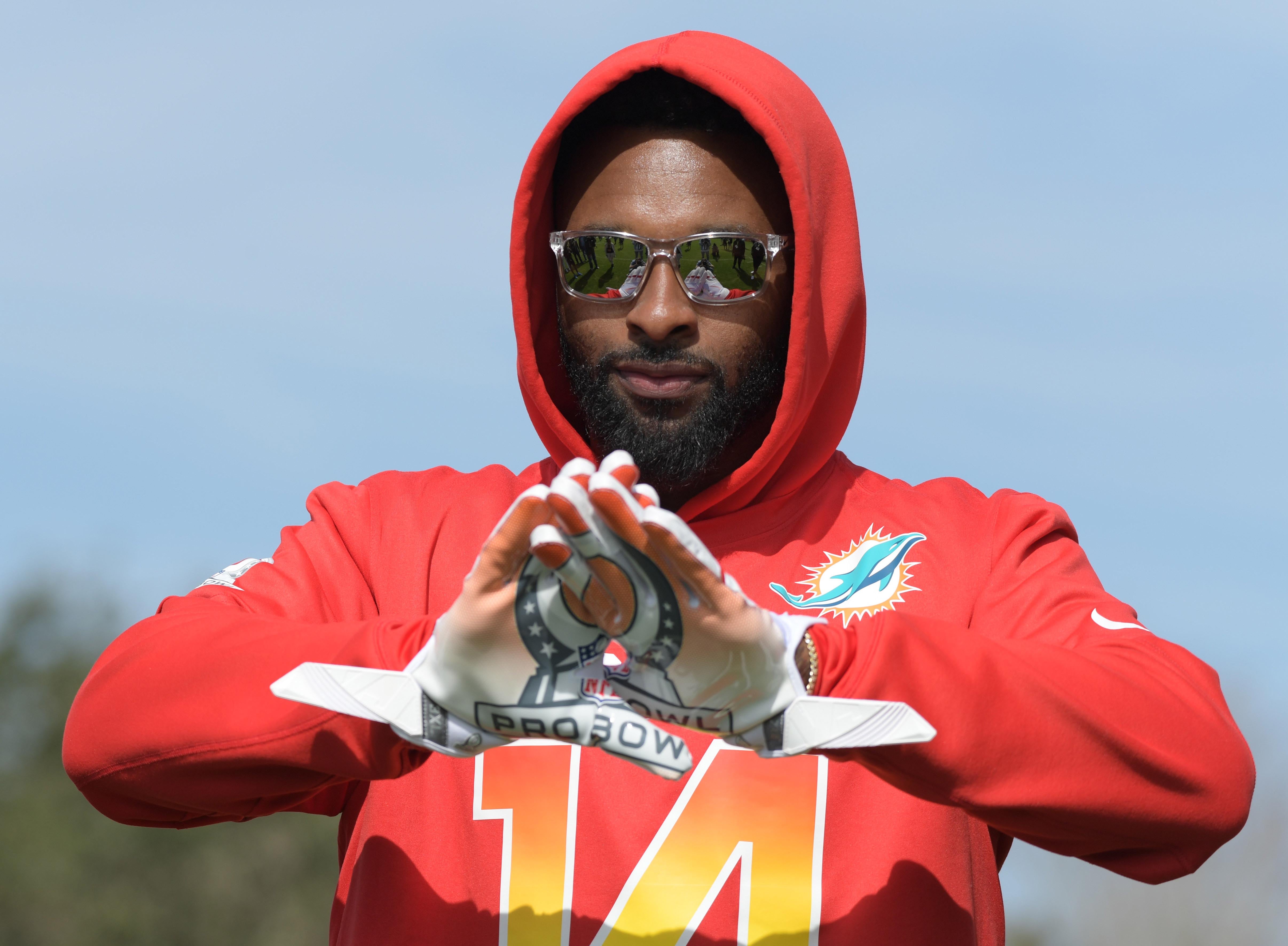 Jan 25, 2018; Kissimmee, FL, USA; Miami Dolphins receiver Jarvis Landry (14) poses with Pro Bowl logo gloves during AFC practice for the 2018 Pro Bowl at ESPN Wide World of Sports.
