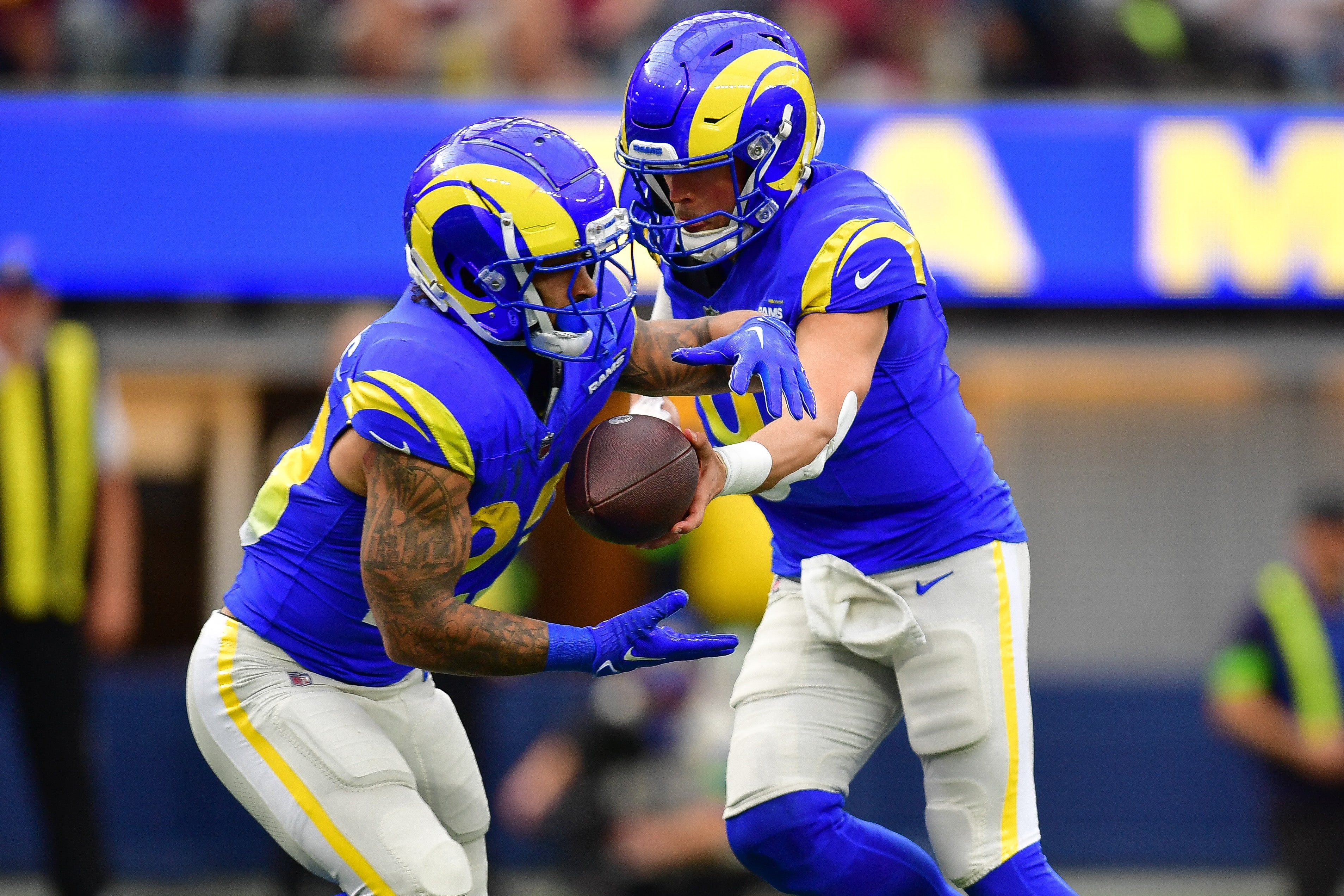 Dec 17, 2023; Inglewood, California, USA; Los Angeles Rams quarterback Matthew Stafford (9) hands off to running back Kyren Williams (23) against the Washington Commanders during the first half at SoFi Stadium. Mandatory Credit: Gary A. Vasquez-USA TODAY Sports