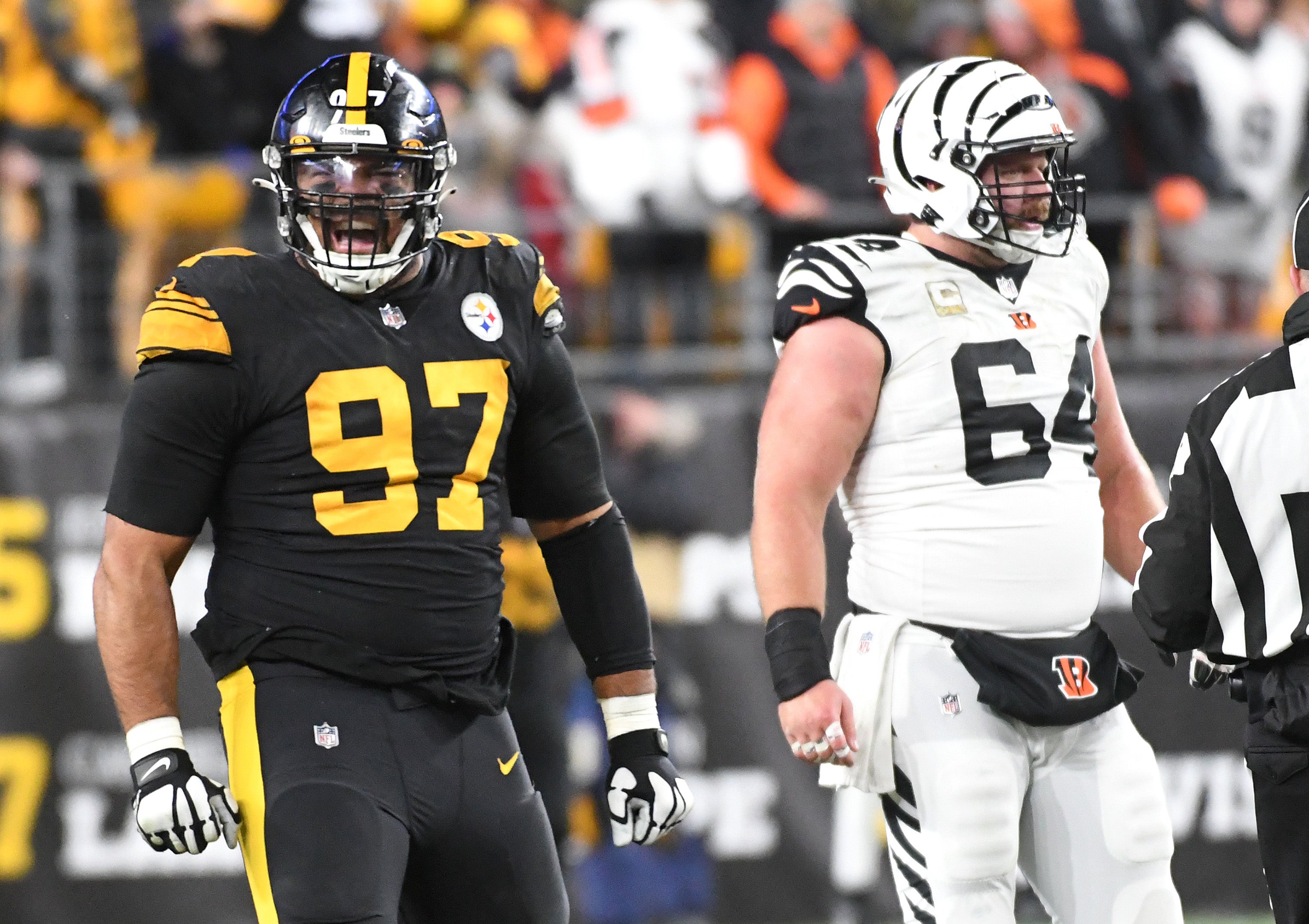 Nov 20, 2022; Pittsburgh, Pennsylvania, USA; Pittsburgh Steelers defensive end Cameron Heyward (97) celebrates a sack near Cincinnati Bengals center Ted Karras (64) during the third quarter at Acrisure Stadium. Mandatory Credit: Philip G. Pavely-USA TODAY Sports