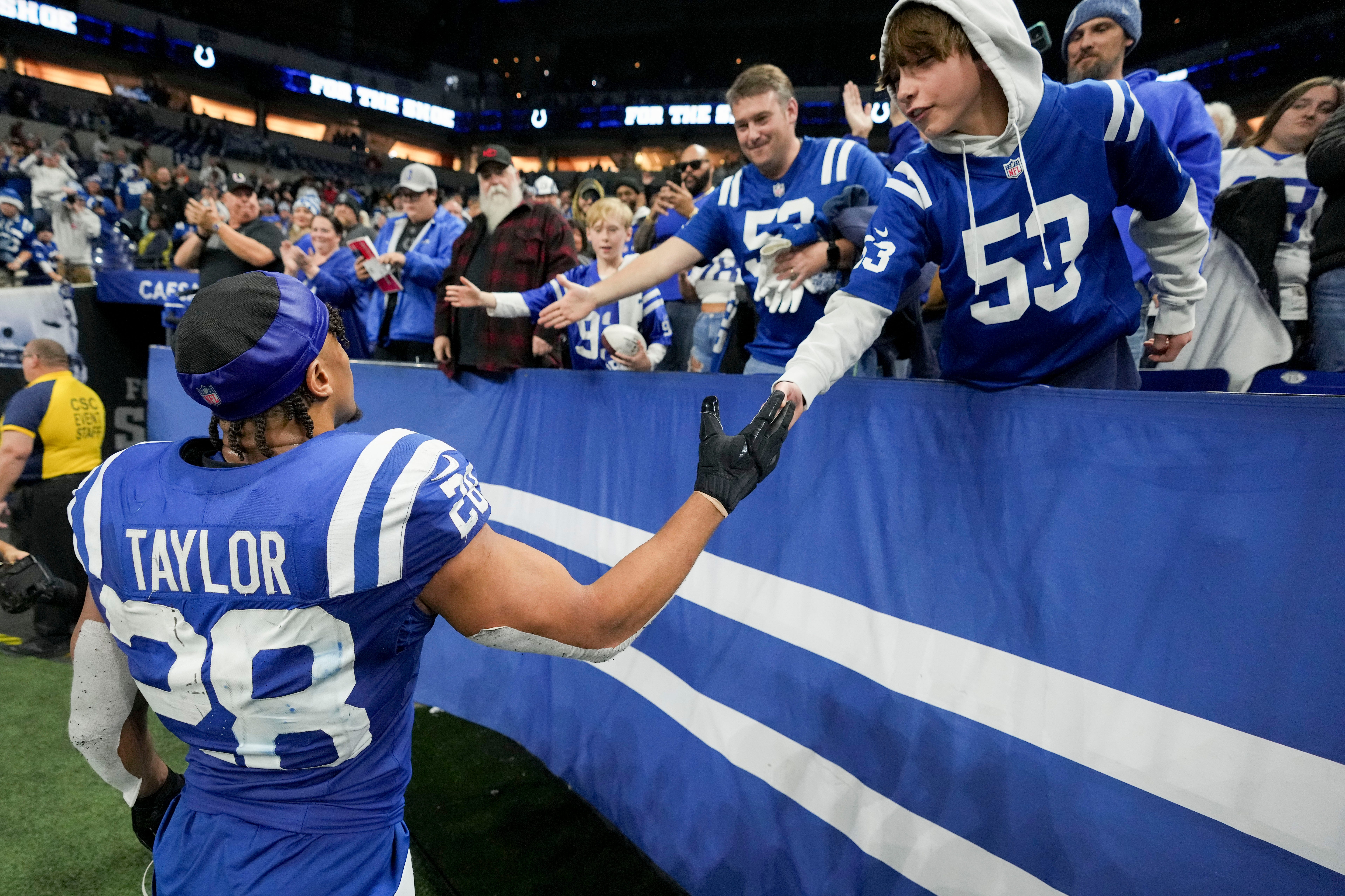 Indianapolis Colts running back Jonathan Taylor (28) celebrates with fans as he leaves the field Sunday, Nov. 26, 2023, after defeating the Tampa Bay Buccaneers at Lucas Oil Stadium in Indianapolis.