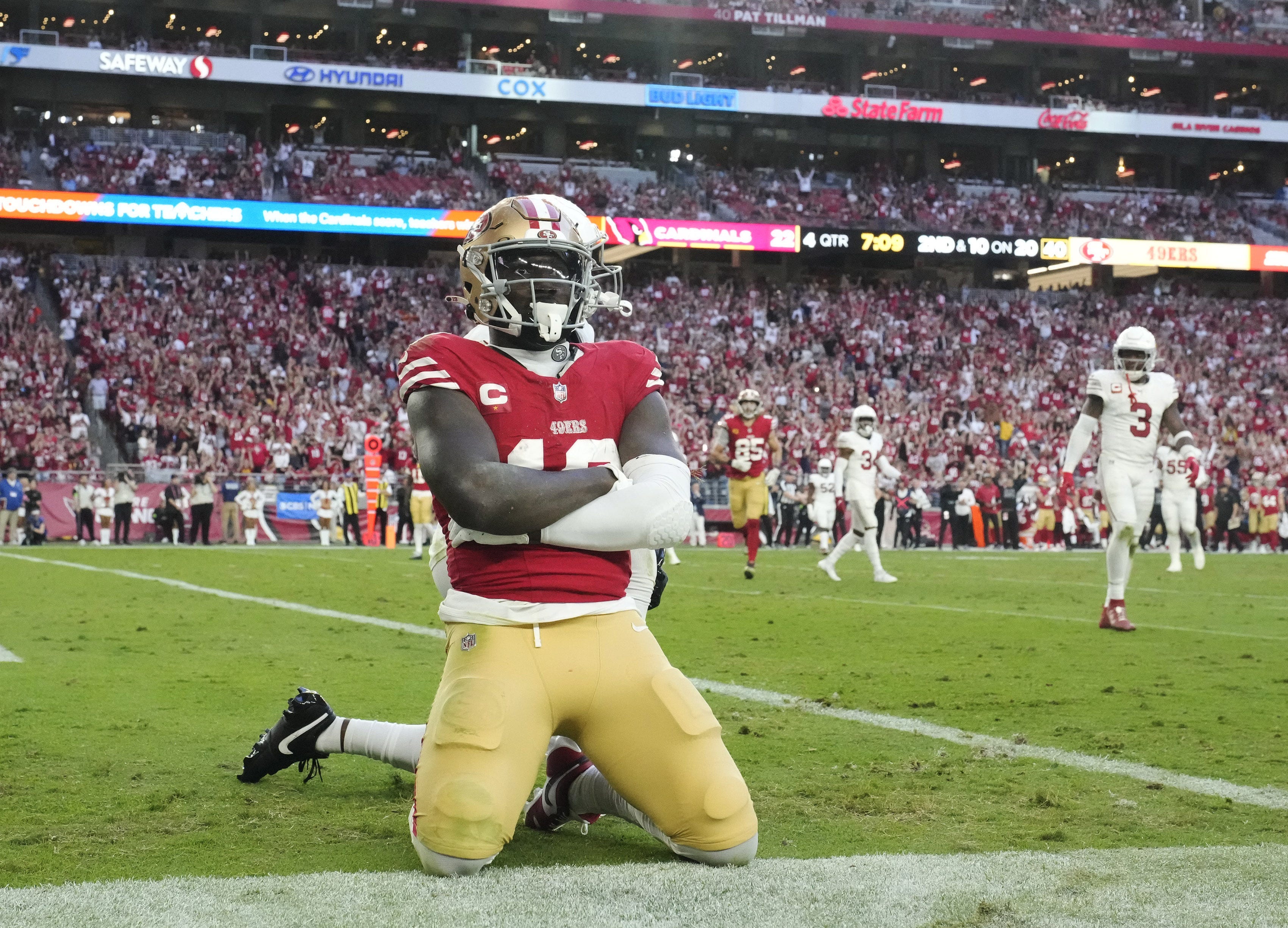 San Francisco 49ers wide receiver Deebo Samuel (19) poses after a touchdown catch against the Arizona Cardinals during the fourth quarter at State Farm Stadium.