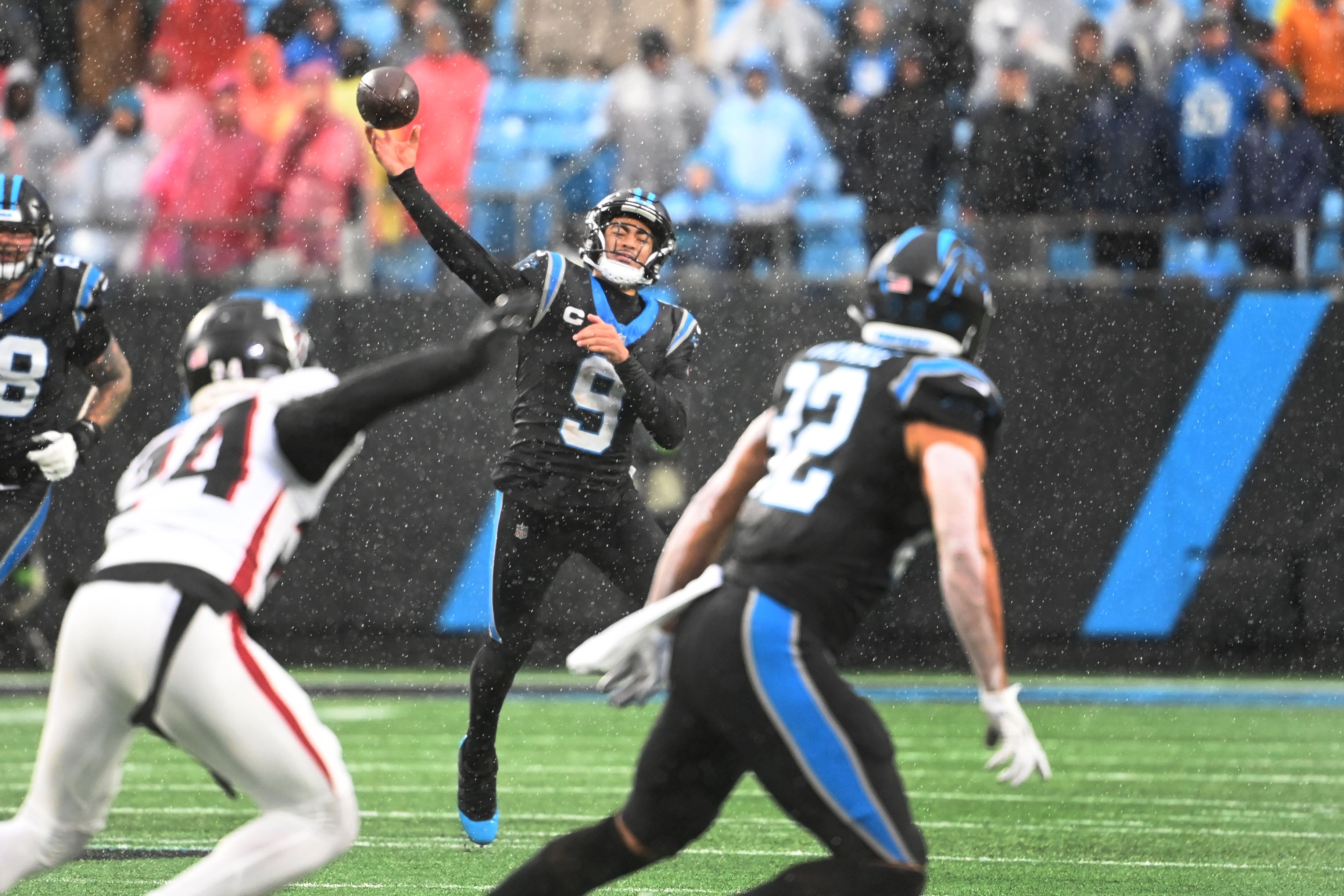 Dec 17, 2023; Charlotte, North Carolina, USA; Carolina Panthers quarterback Bryce Young (9) passes the ball to tight end Tommy Tremble (82) as Atlanta Falcons cornerback A.J. Terrell (24) defends in the third quarter at Bank of America Stadium. Mandatory Credit: Bob Donnan-USA TODAY Sports