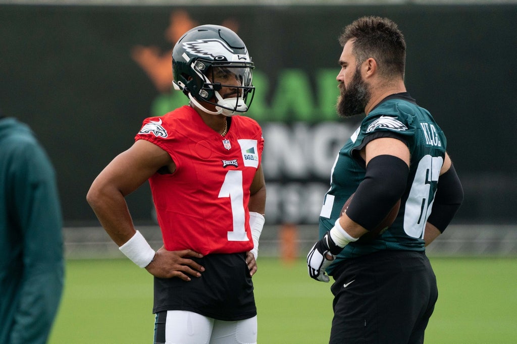 Philadelphia Eagles quarterback Jalen Hurts (1) and center Jason Kelce (62) at training camp at NovaCare Complex.