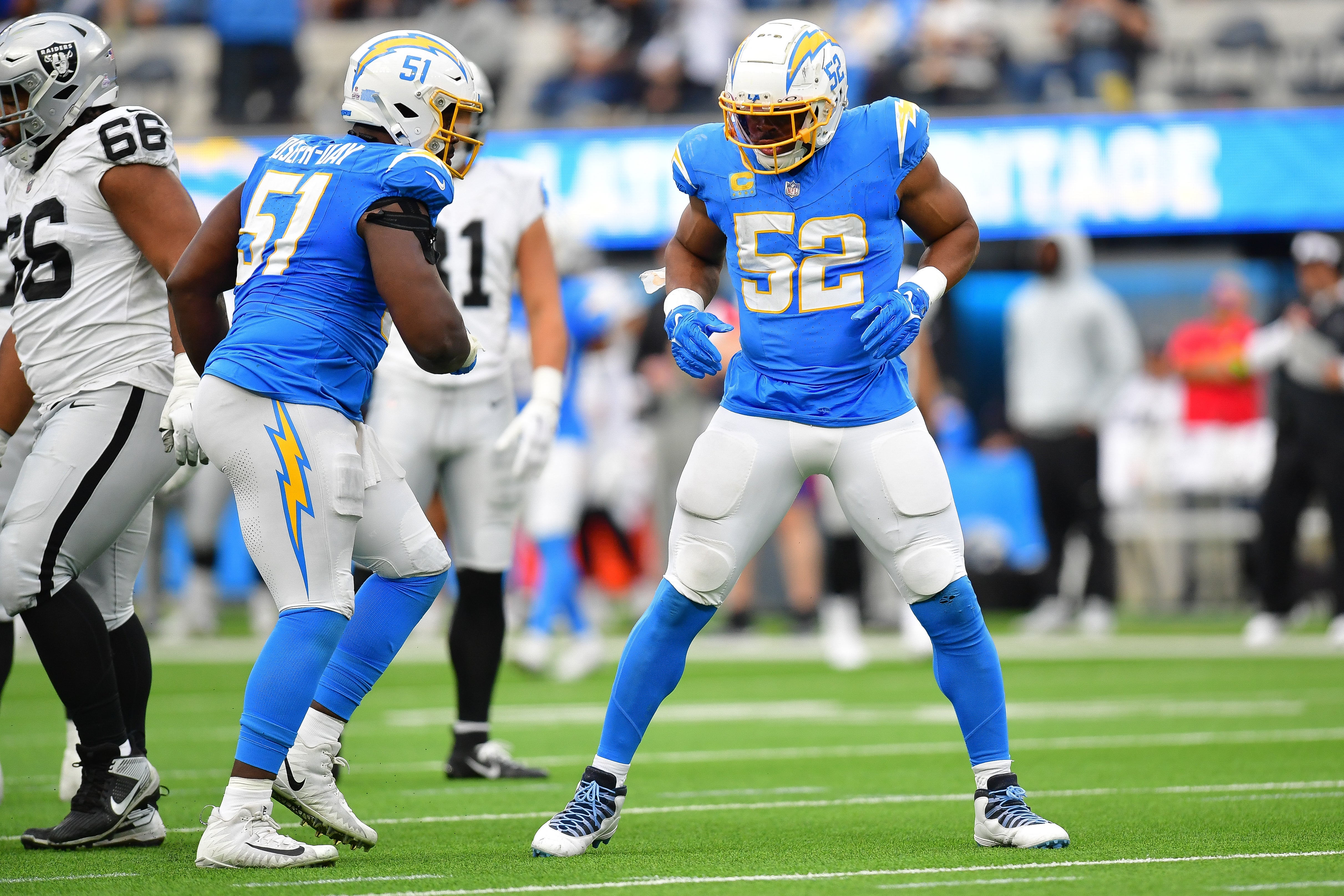 Oct 1, 2023; Inglewood, California, USA; Los Angeles Chargers linebacker Khalil Mack (52) reacts after sacking Las Vegas Raiders quarterback Aidan O'Connell (4) with defensive tackle Sebastian Joseph-Day (51) during the second half at SoFi Stadium.