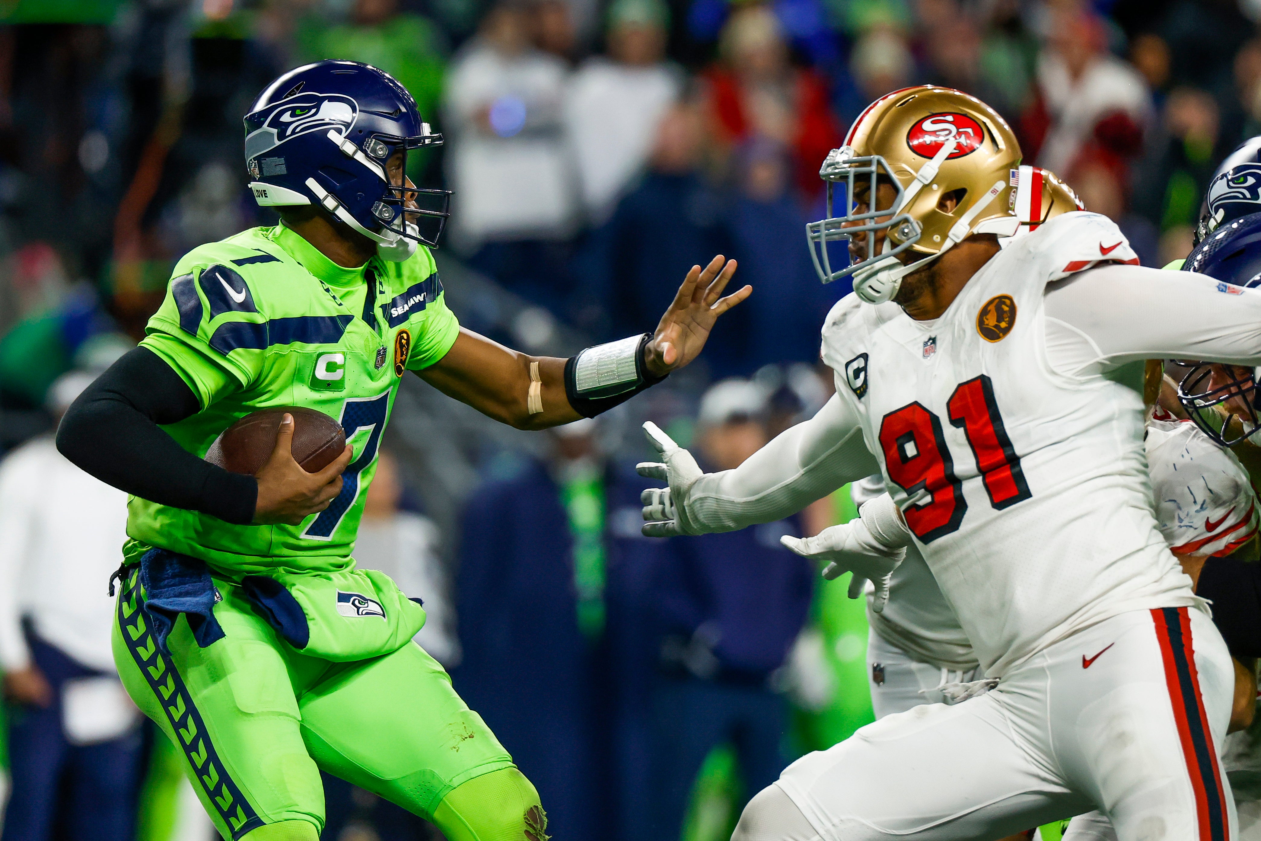 Nov 23, 2023; Seattle, Washington, USA; San Francisco 49ers defensive end Arik Armstead (91) sacks Seattle Seahawks quarterback Geno Smith (7) during the fourth quarter at Lumen Field.