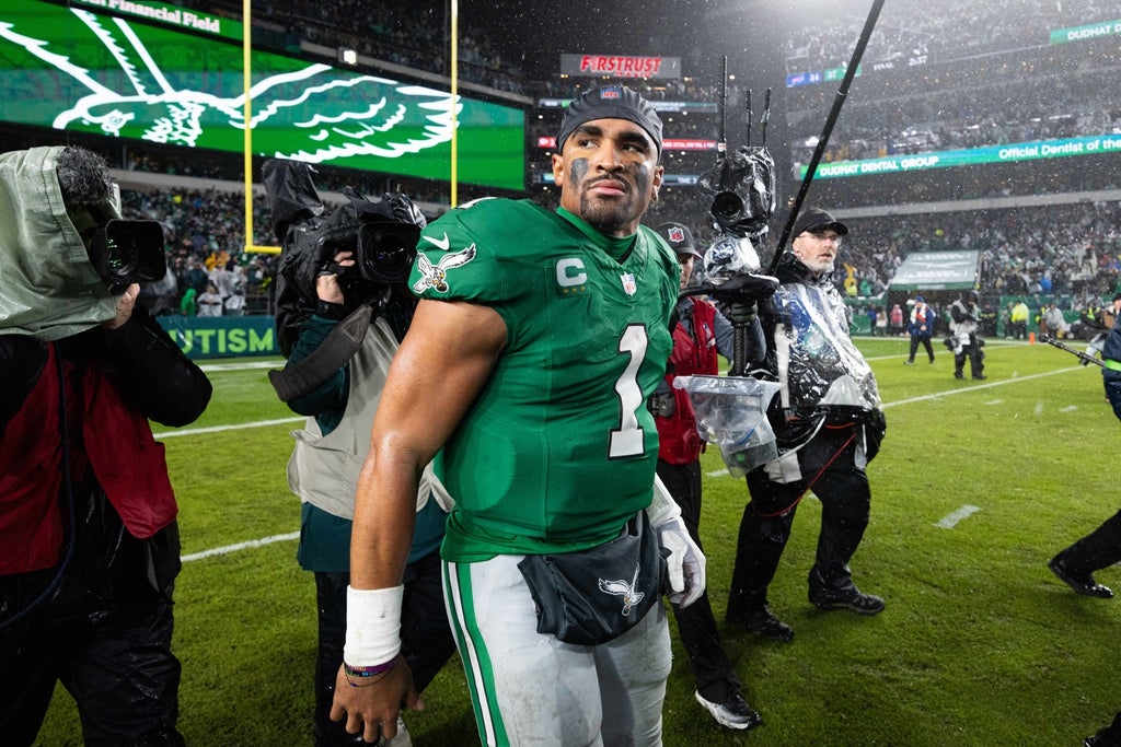 Philadelphia Eagles quarterback Jalen Hurts (1) walks off the field after an overtime victory against the Buffalo Bills at Lincoln Financial Field.