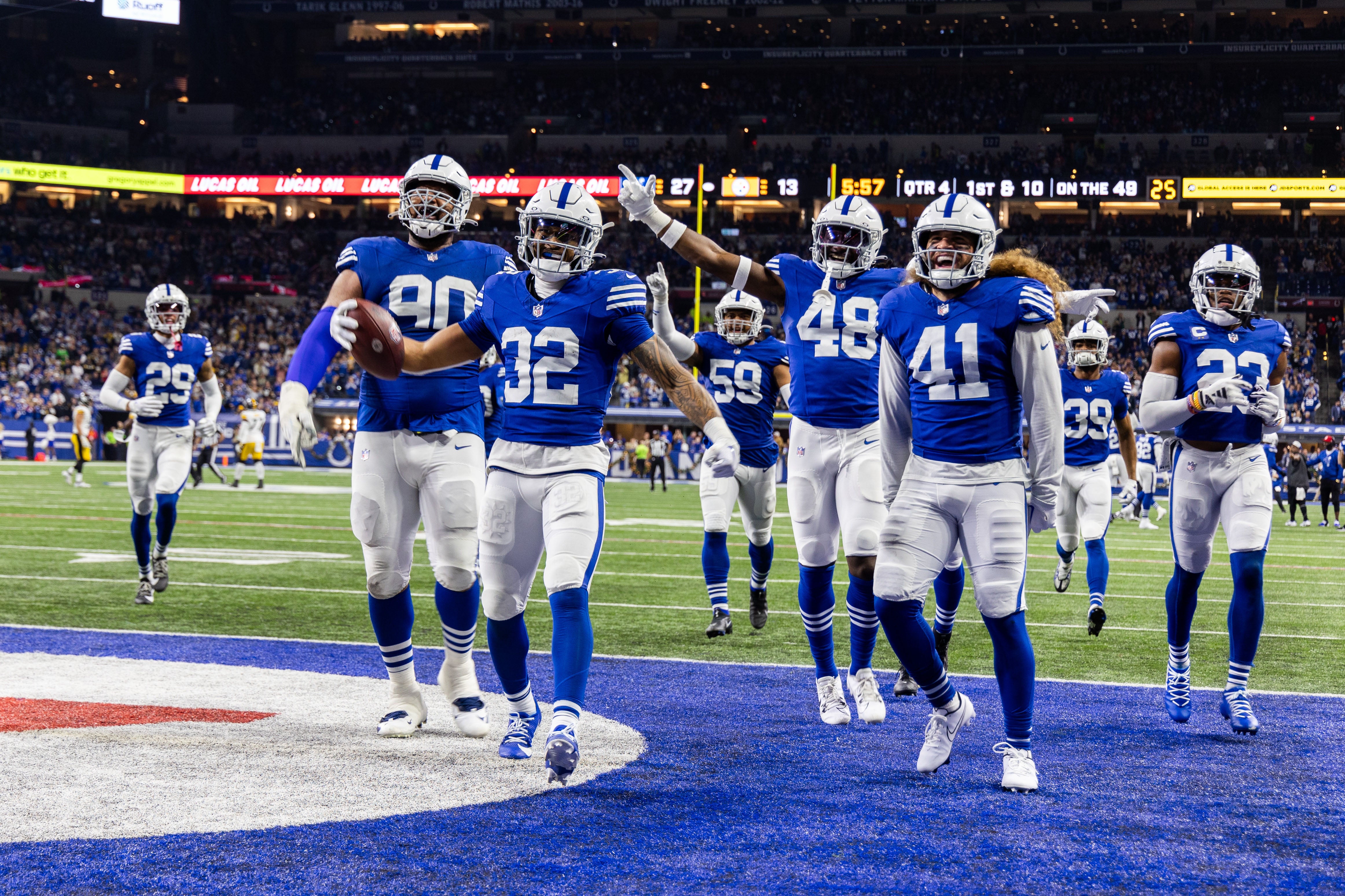 Dec 16, 2023; Indianapolis, Indiana, USA; Indianapolis Colts safety Julian Blackmon (32) celebrates his interception with teammates in the second half against the Pittsburgh Steelers at Lucas Oil Stadium.