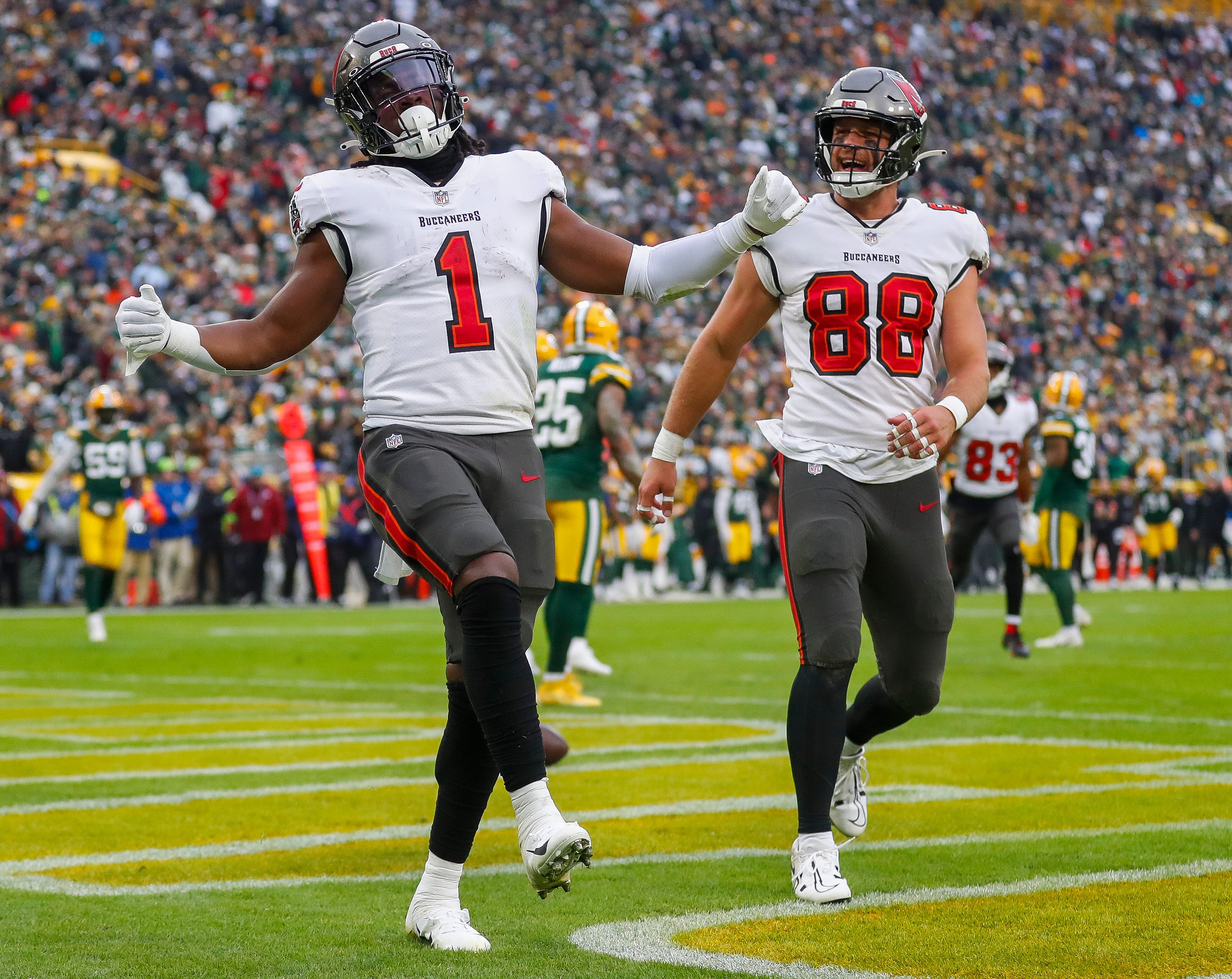 Tampa Bay Buccaneers running back Rachaad White (1) and tight end Cade Otton (88) celebrate after White scores a touchdown against the Green Bay Packers on Sunday, December 17, 2023, at Lambeau Field in Green Bay, Wis. Tampa Bay won the game, 34-20.
