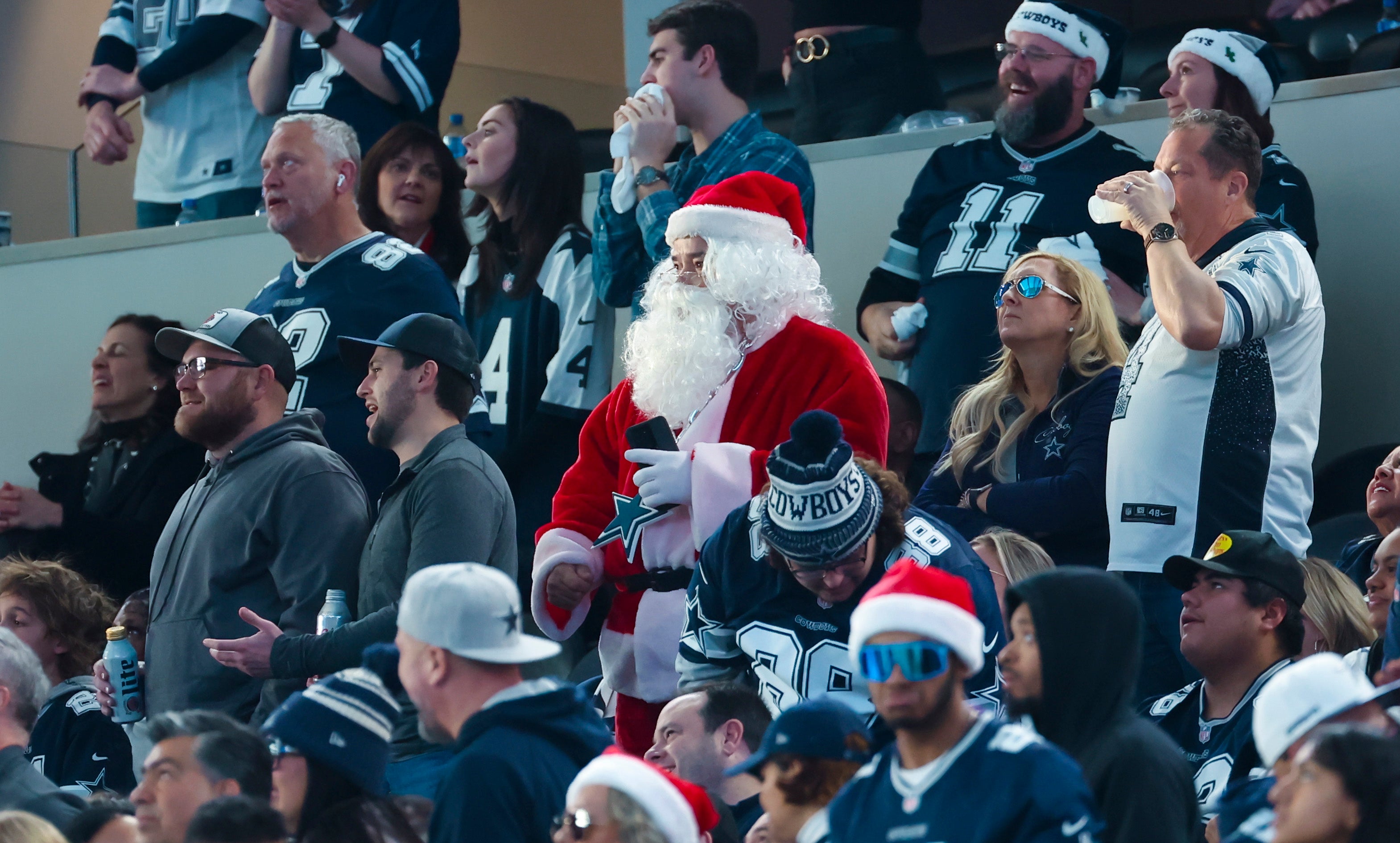 A fan dressed as Santa Claus during the game between the Dallas Cowboys and Philadelphia Eagles at AT&T Stadium.