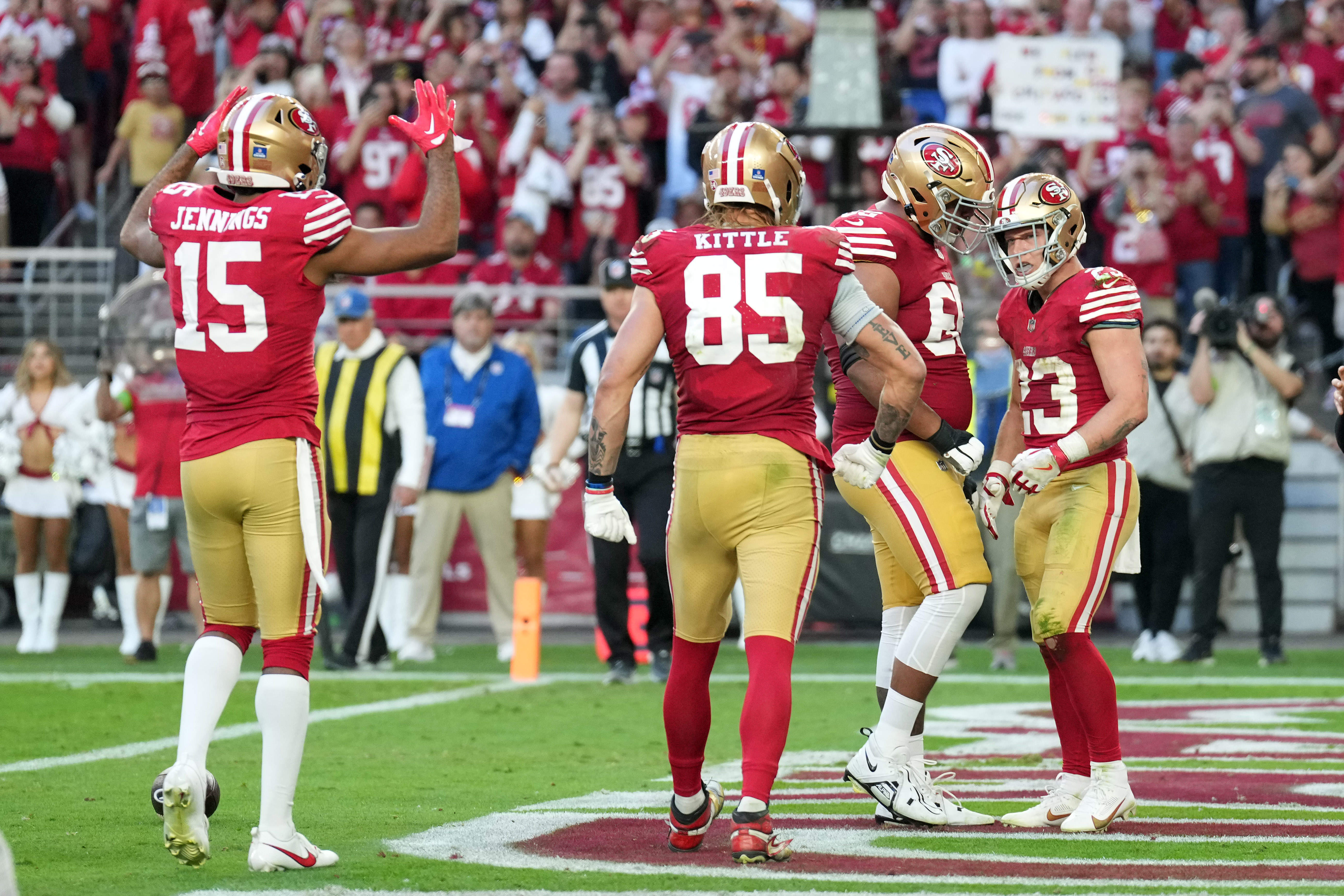 Dec 17, 2023; Glendale, Arizona, USA; San Francisco 49ers running back Christian McCaffrey (23) celebrates a touchdown against the Arizona Cardinals during the second half at State Farm Stadium.