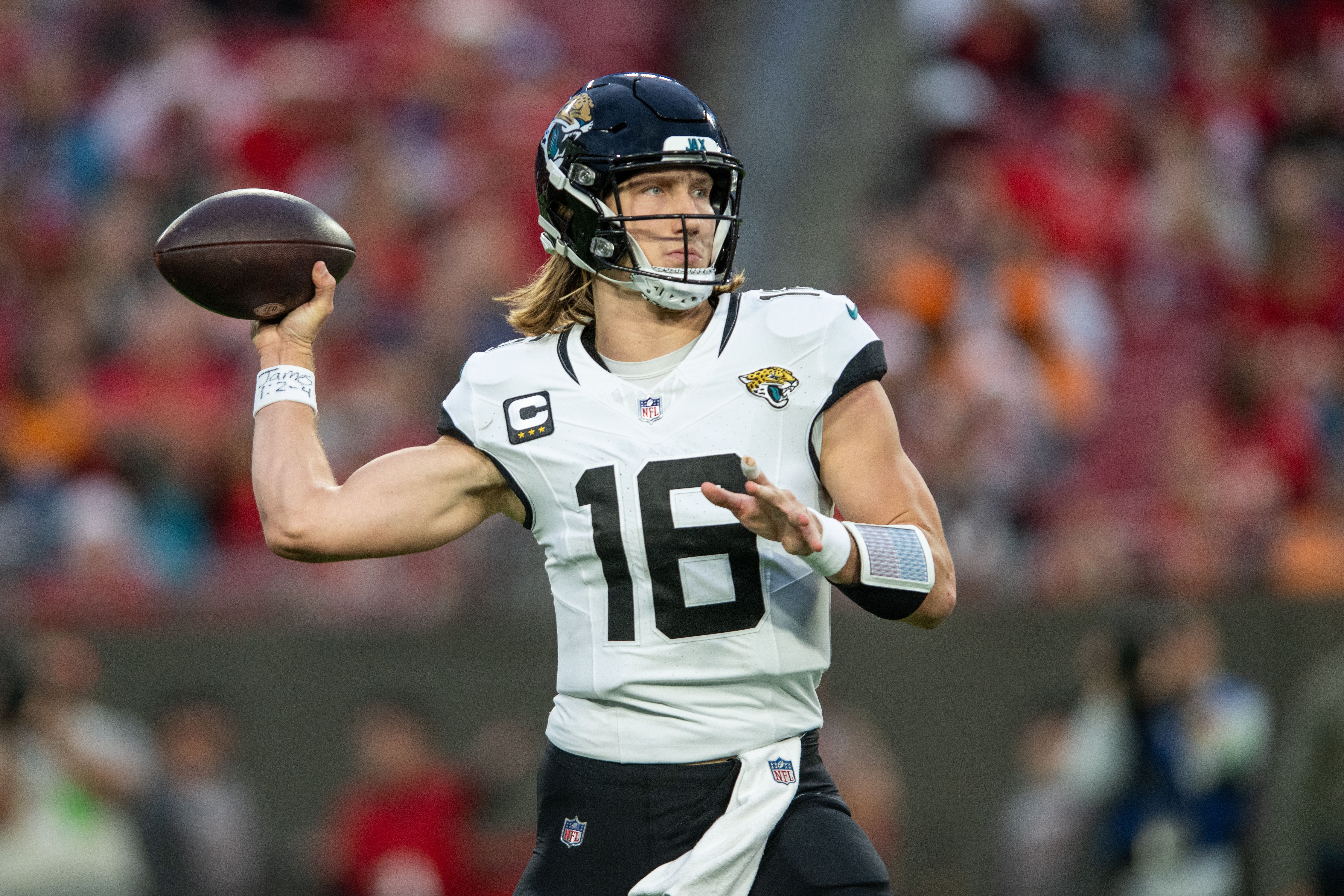 Dec 24, 2023; Tampa, Florida, USA; Jacksonville Jaguars quarterback Trevor Lawrence (16) throws the ball against the Tampa Bay Buccaneers in the second quarter at Raymond James Stadium. Mandatory Credit: Jeremy Reper-USA TODAY Sports
