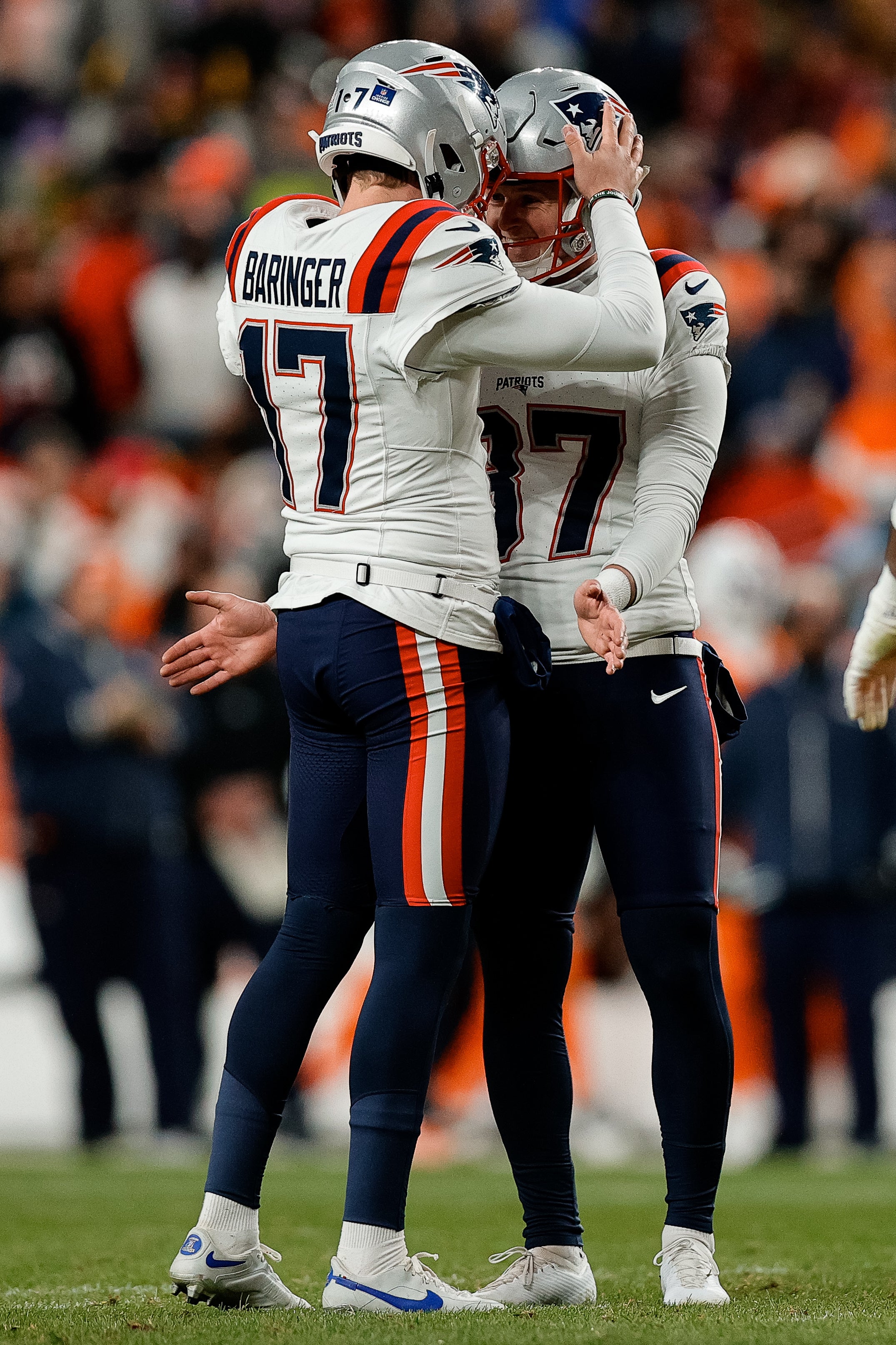 New England Patriots place kicker Chad Ryland reacts with punter Bryce Baringer after a field goal in the second quarter against the Denver Broncos at Empower Field at Mile High