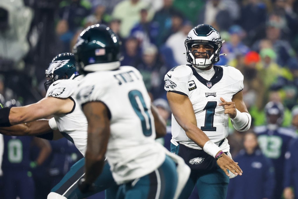 Philadelphia Eagles quarterback Jalen Hurts (1) passes against the Seattle Seahawks during the first quarter at Lumen Field.