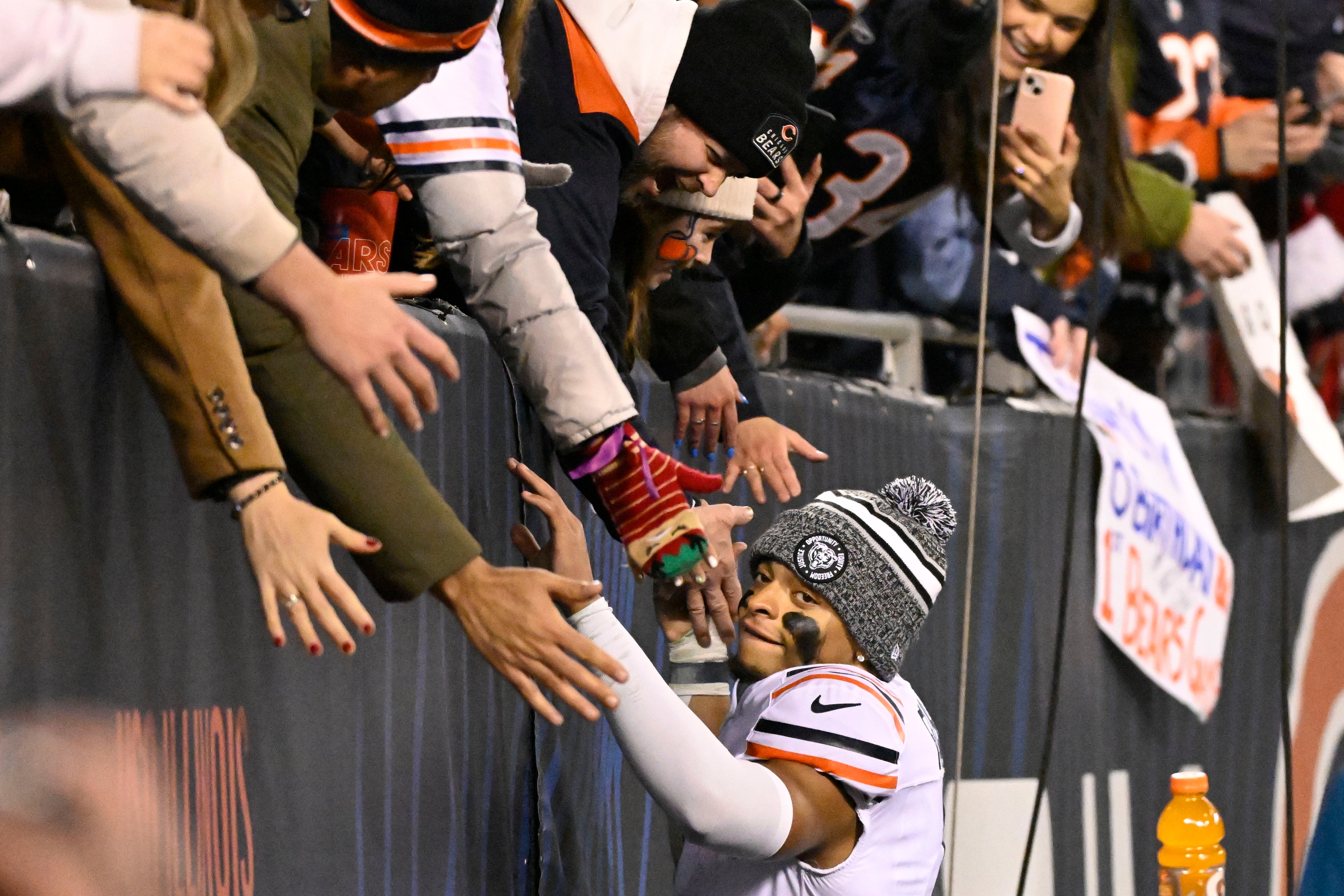 Dec 24, 2023; Chicago, Illinois, USA; Chicago Bears quarterback Justin Fields (1) greets fans after the second half against the Arizona Cardinals at Soldier Field.