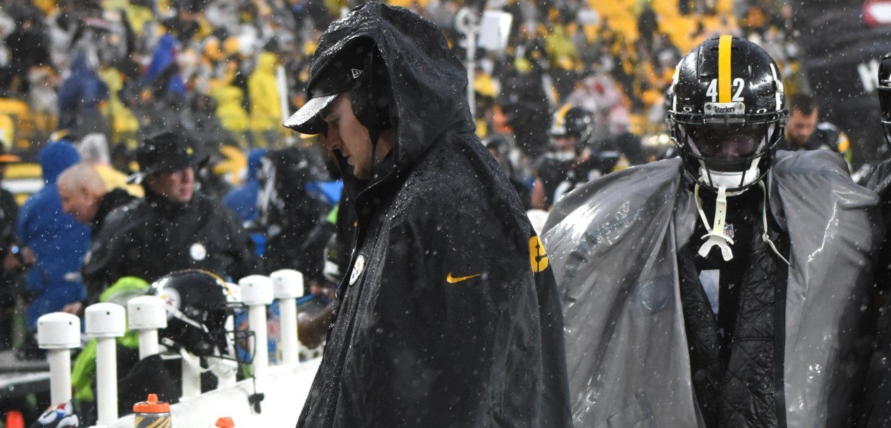 Dec 3, 2023; Pittsburgh, Pennsylvania, USA; Pittsburgh Steelers quarterback Kenny Pickett leaves the field in a boot after another weather delay against the Arizona Cardinals during the third quarter at Acrisure Stadium. Mandatory Credit: Philip G. Pavely-USA TODAY Sports