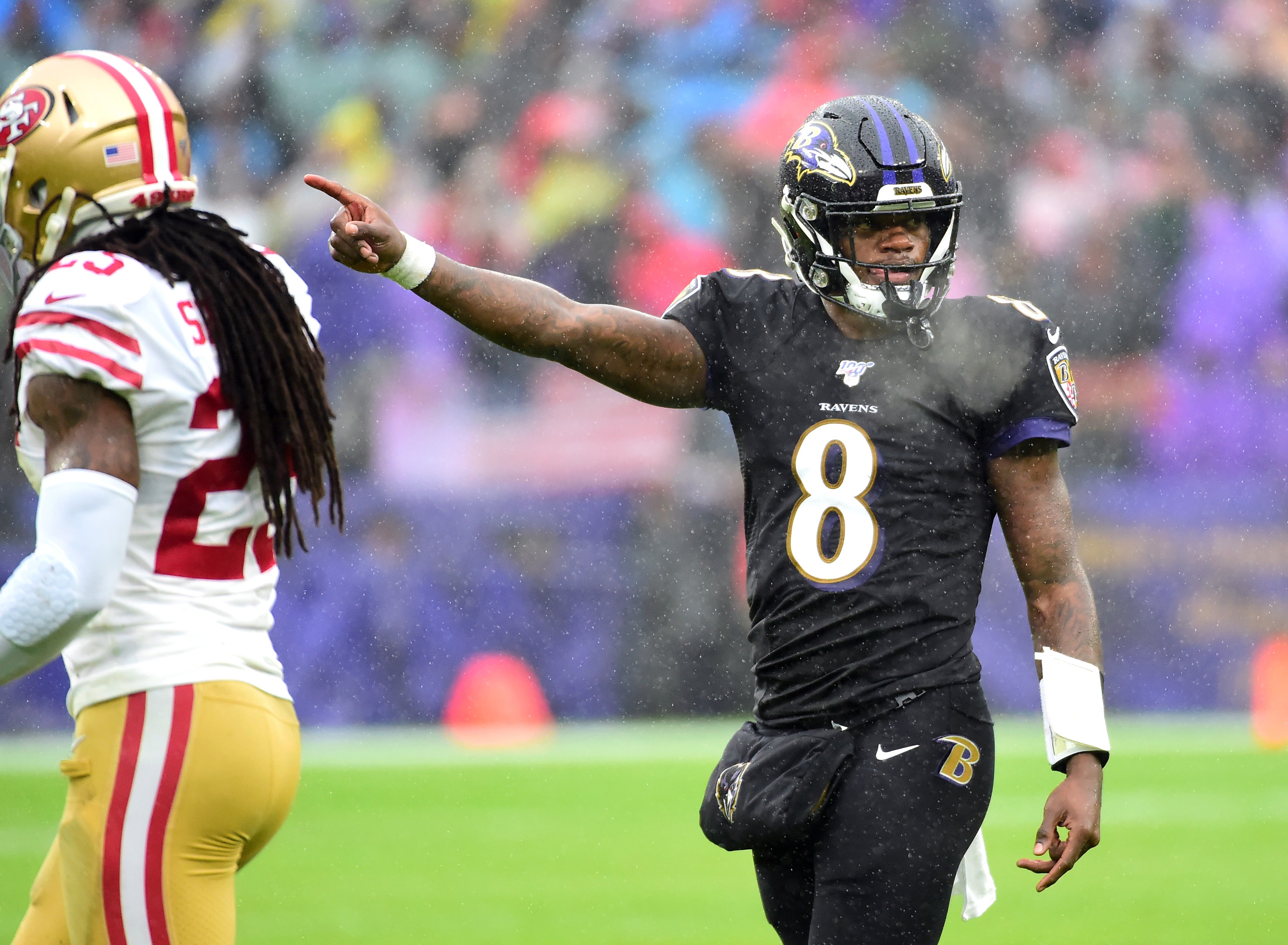 Dec 1, 2019; Baltimore, MD, USA; Baltimore Ravens quarterback Lamar Jackson (8) indicates a first down in the second quarter against the San Francisco 49ers at M&T Bank Stadium. Mandatory Credit: Evan Habeeb-USA TODAY Sports