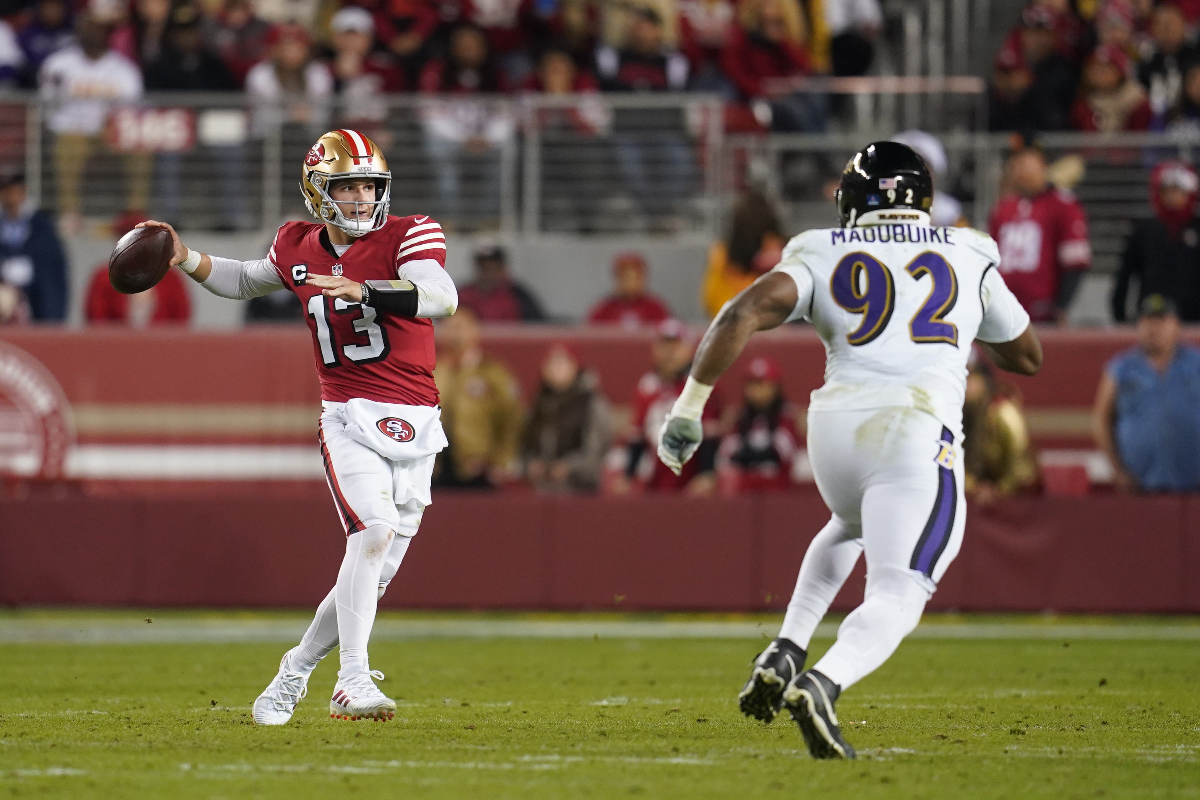 Dec 25, 2023; Santa Clara, California, USA; San Francisco 49ers quarterback Brock Purdy (13) throws a pass next to Baltimore Ravens defensive tackle Justin Madubuike (92) in the second quarter at Levi's Stadium.