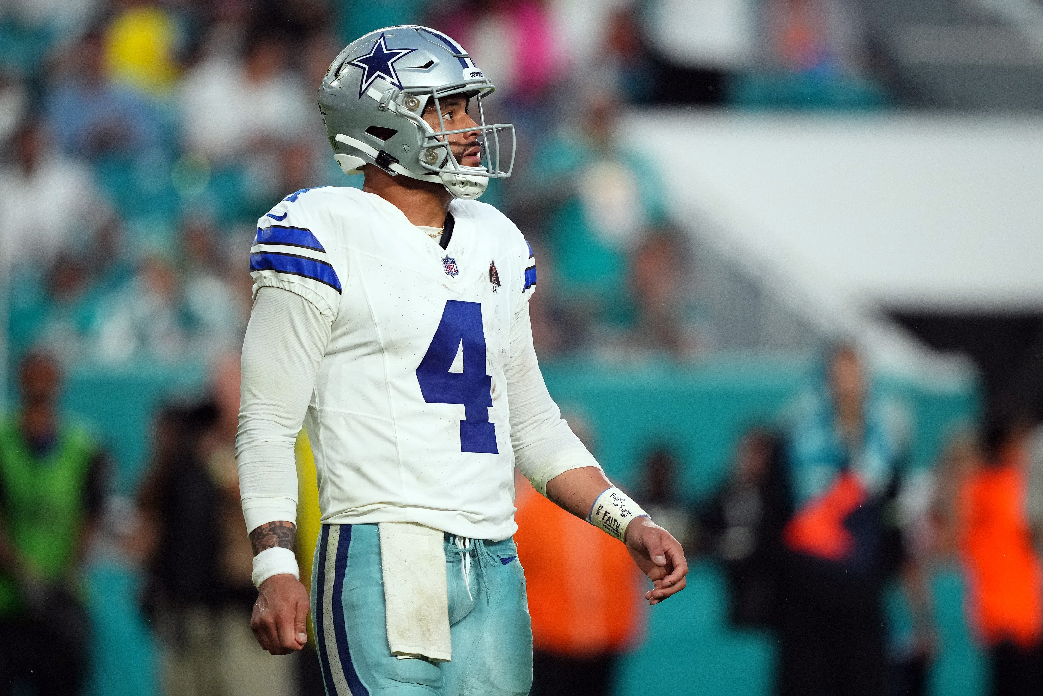 Dallas Cowboys quarterback Dak Prescott (4) walks on the the field after a play during the first half against the Miami Dolphins at Hard Rock Stadium.