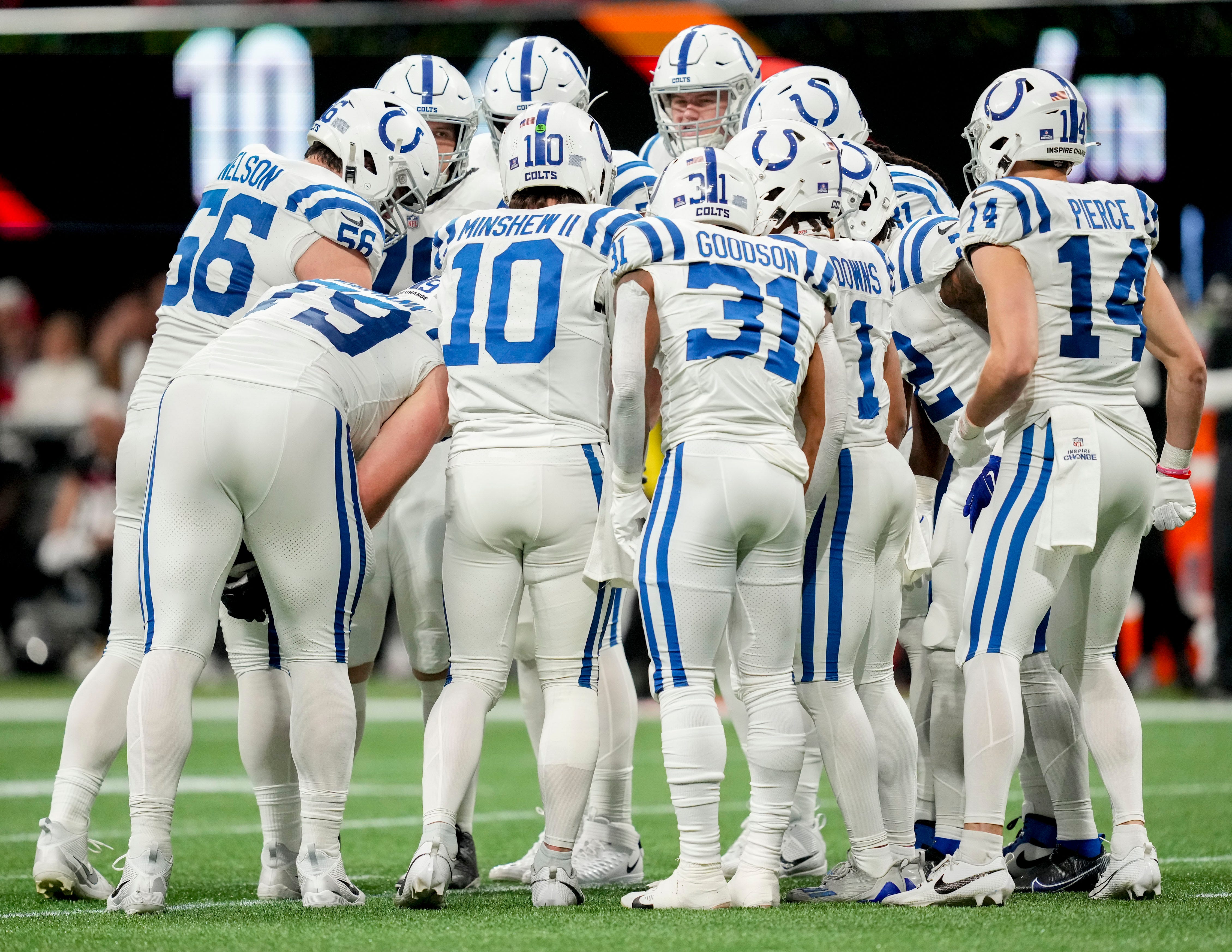 The Indianapolis Colts offense huddles before a play Sunday, Dec. 24, 2023, during a game against the Atlanta Falcons at Mercedes-Benz Stadium in Atlanta.