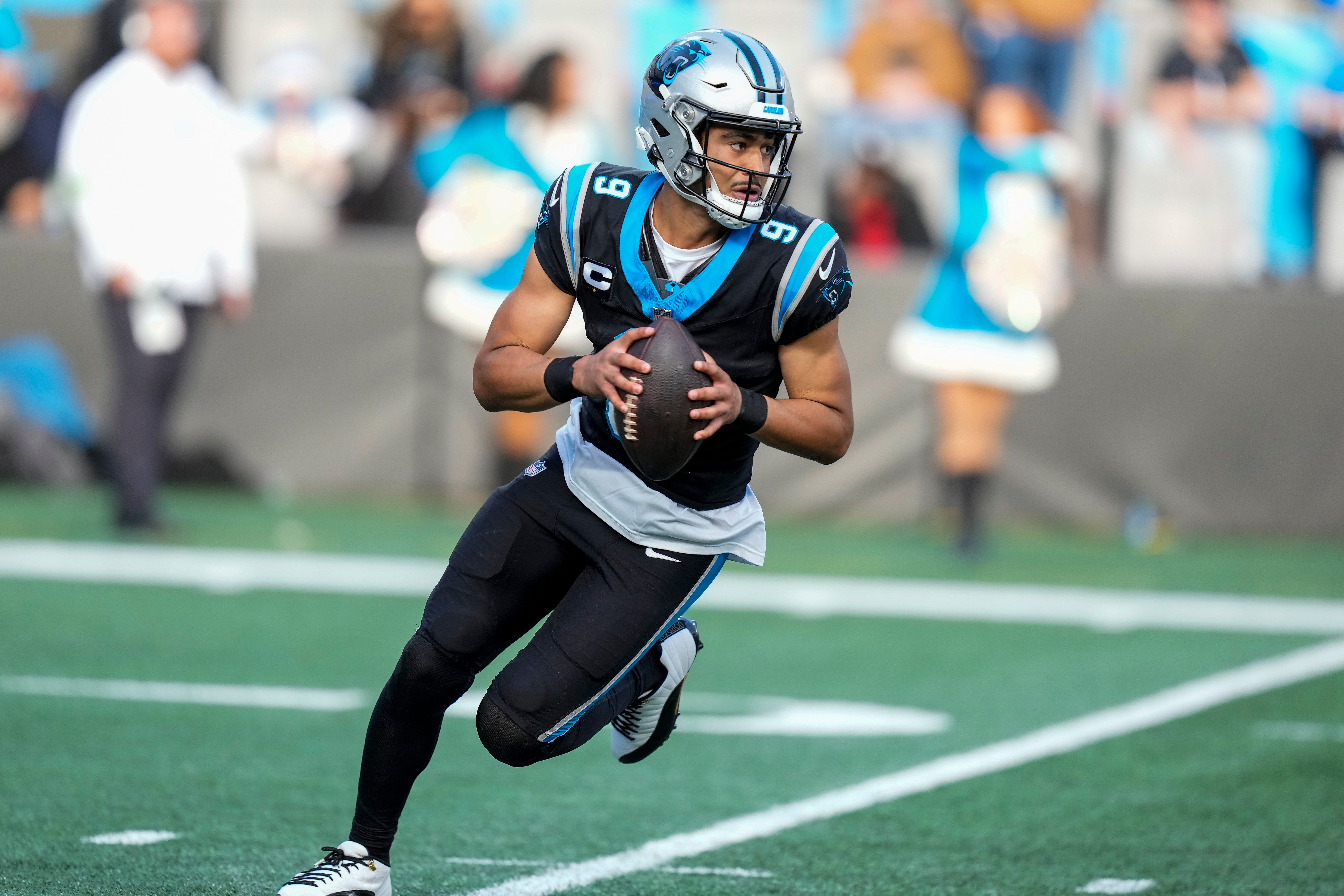 Dec 24, 2023; Charlotte, North Carolina, USA; Carolina Panthers quarterback Bryce Young (9) runs out of the pocket against the Green Bay Packers during the second half at Bank of America Stadium. Mandatory Credit: Jim Dedmon-USA TODAY Sports