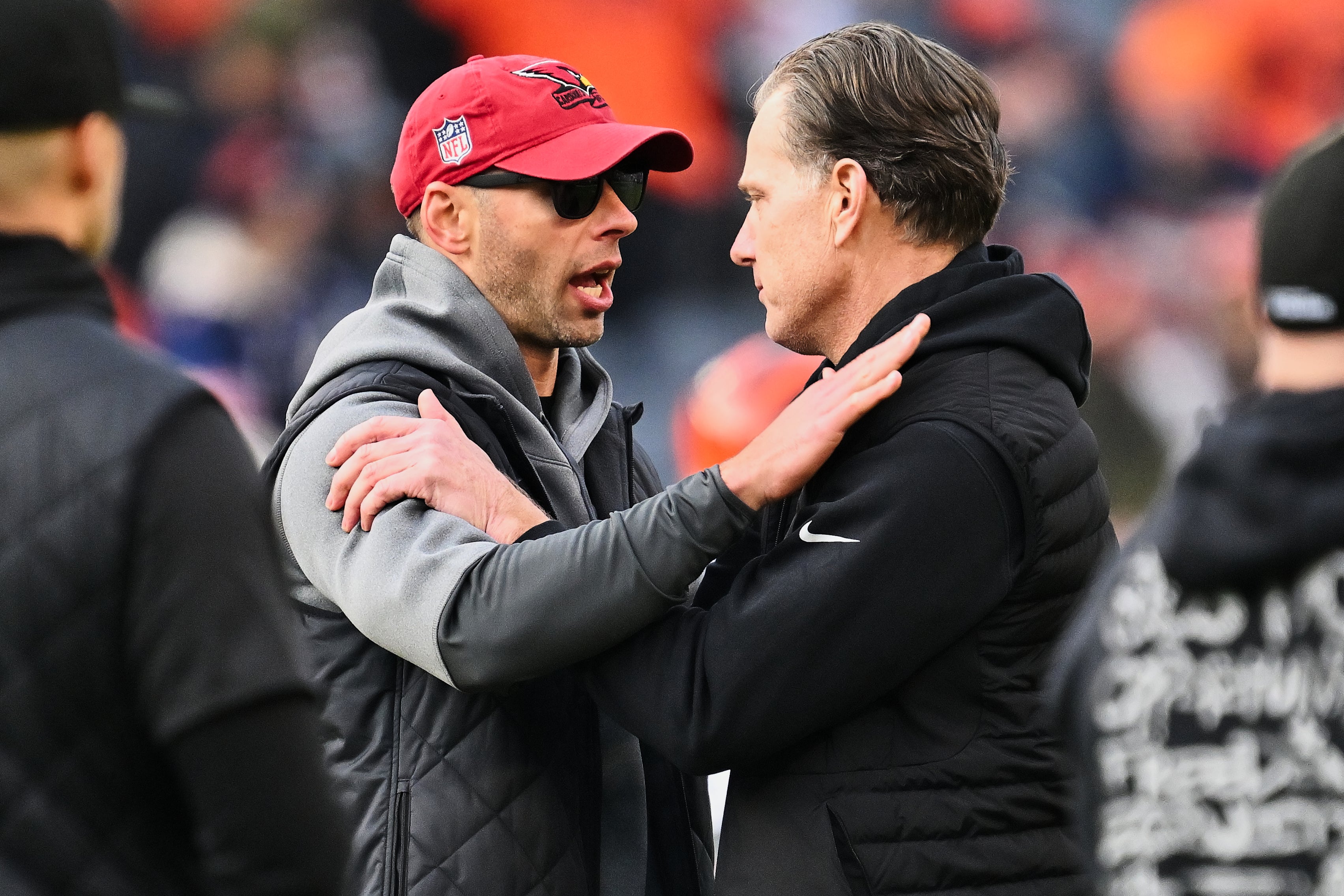 Dec 24, 2023; Chicago, Illinois, USA; Arizona Cardinals head coach Jonathan Gannon, left and Chicago Bears head coach Matt Eberflus meet at midfield during the pregame warmups before their game at Soldier Field.
