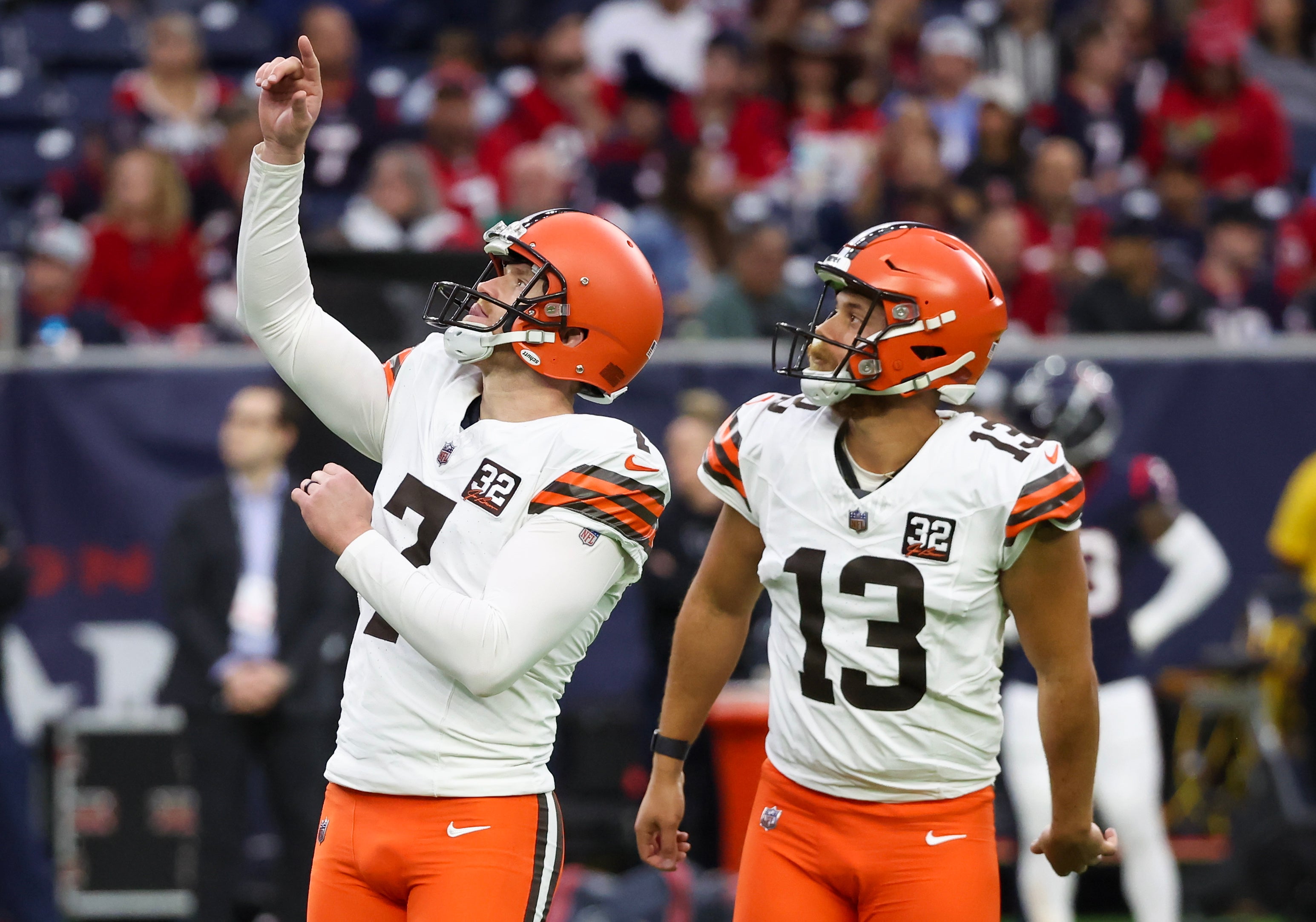 Dec 24, 2023; Houston, Texas, USA; Cleveland Browns place kicker Dustin Hopkins (7) celebrates his extra point with holder Corey Bojorquez (13) against the Houston Texans in the second quarter at NRG Stadium. Mandatory Credit: Thomas Shea-USA TODAY Sports