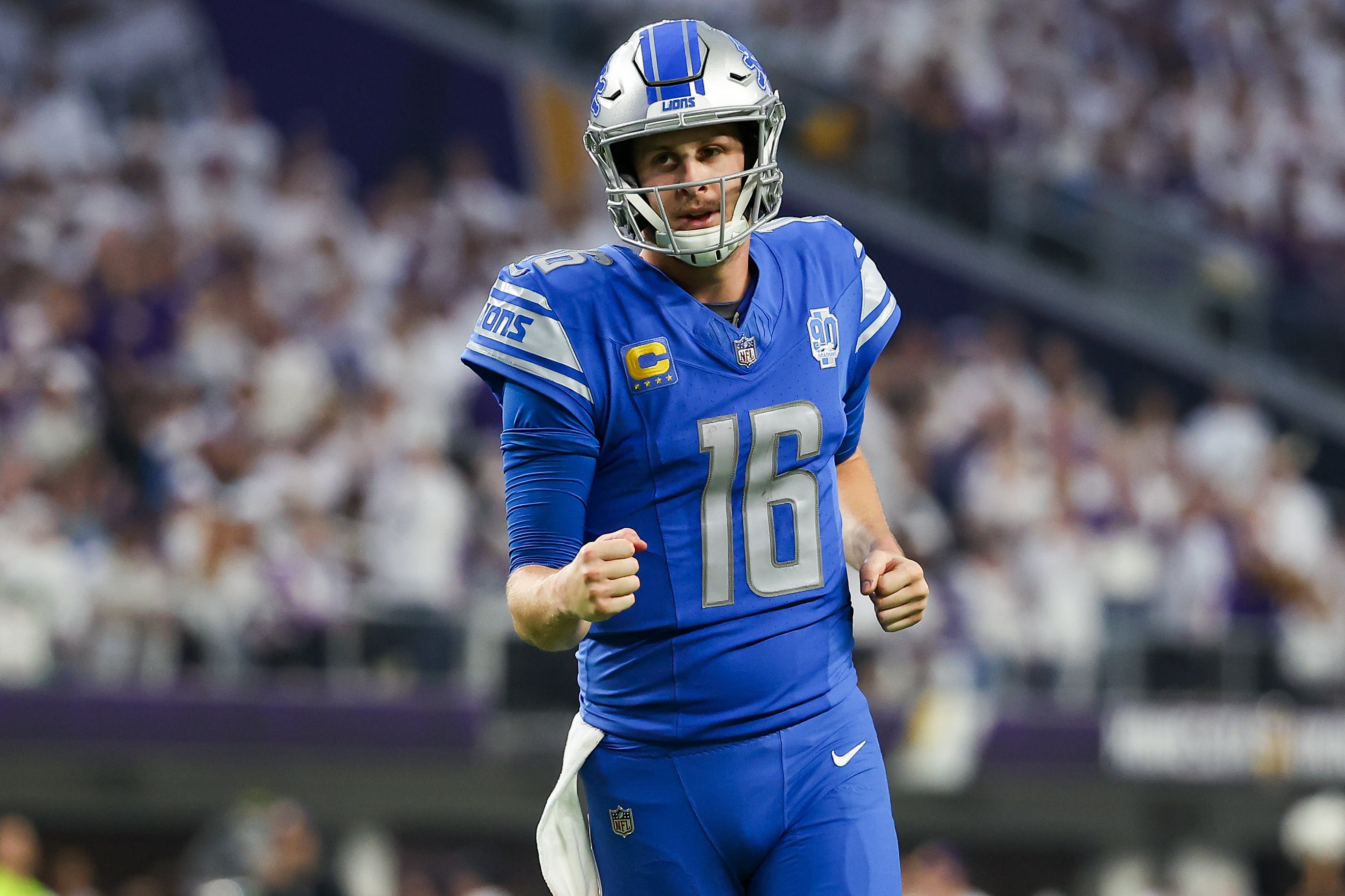 Dec 24, 2023; Minneapolis, Minnesota, USA; Detroit Lions quarterback Jared Goff (16) celebrates after running back Jahmyr Gibbs (26) runs for a touchdown against the Minnesota Vikings during the fourth quarter at U.S. Bank Stadium.